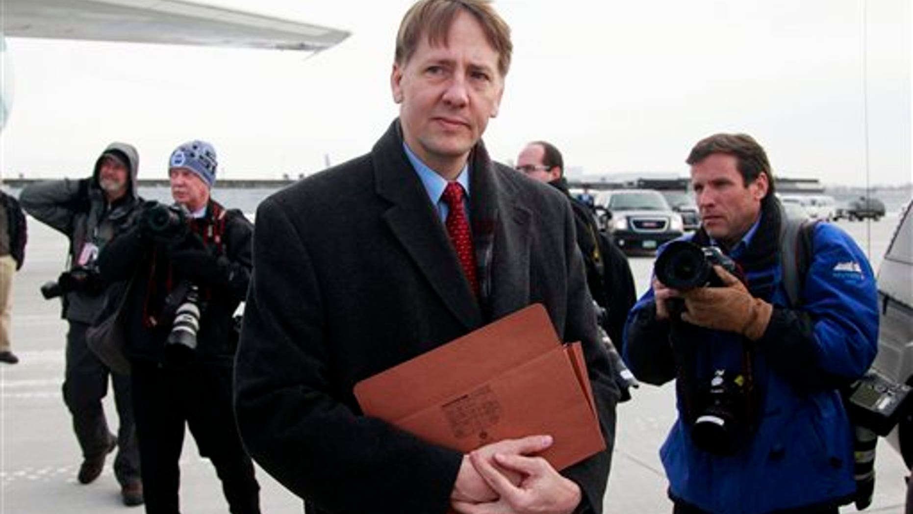 Jan. 4: former Ohio Attorney General Richard Cordray is photographed by the media in Cleveland.
