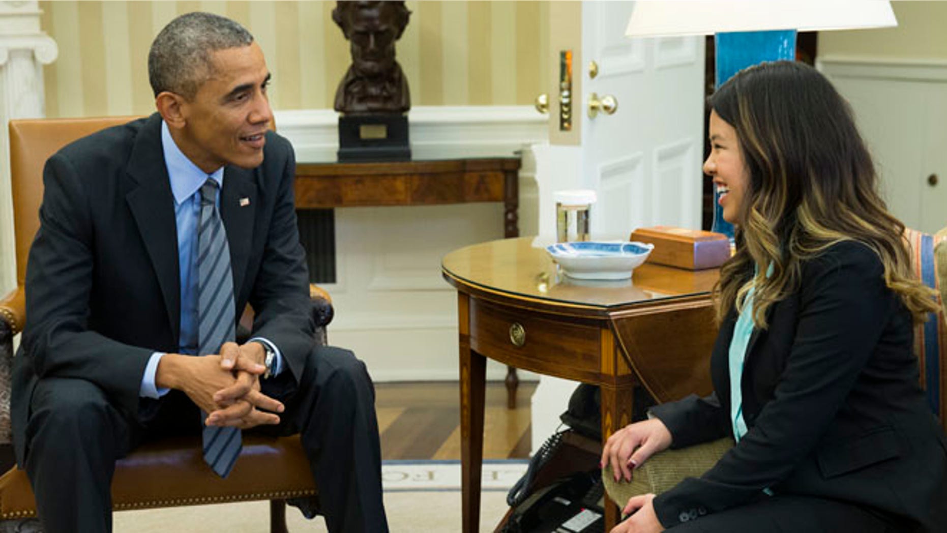 In this Friday, Oct. 24 photo, President Barack Obama meets with Ebola survivor Nina Pham in the Oval Office of the White House in Washington.