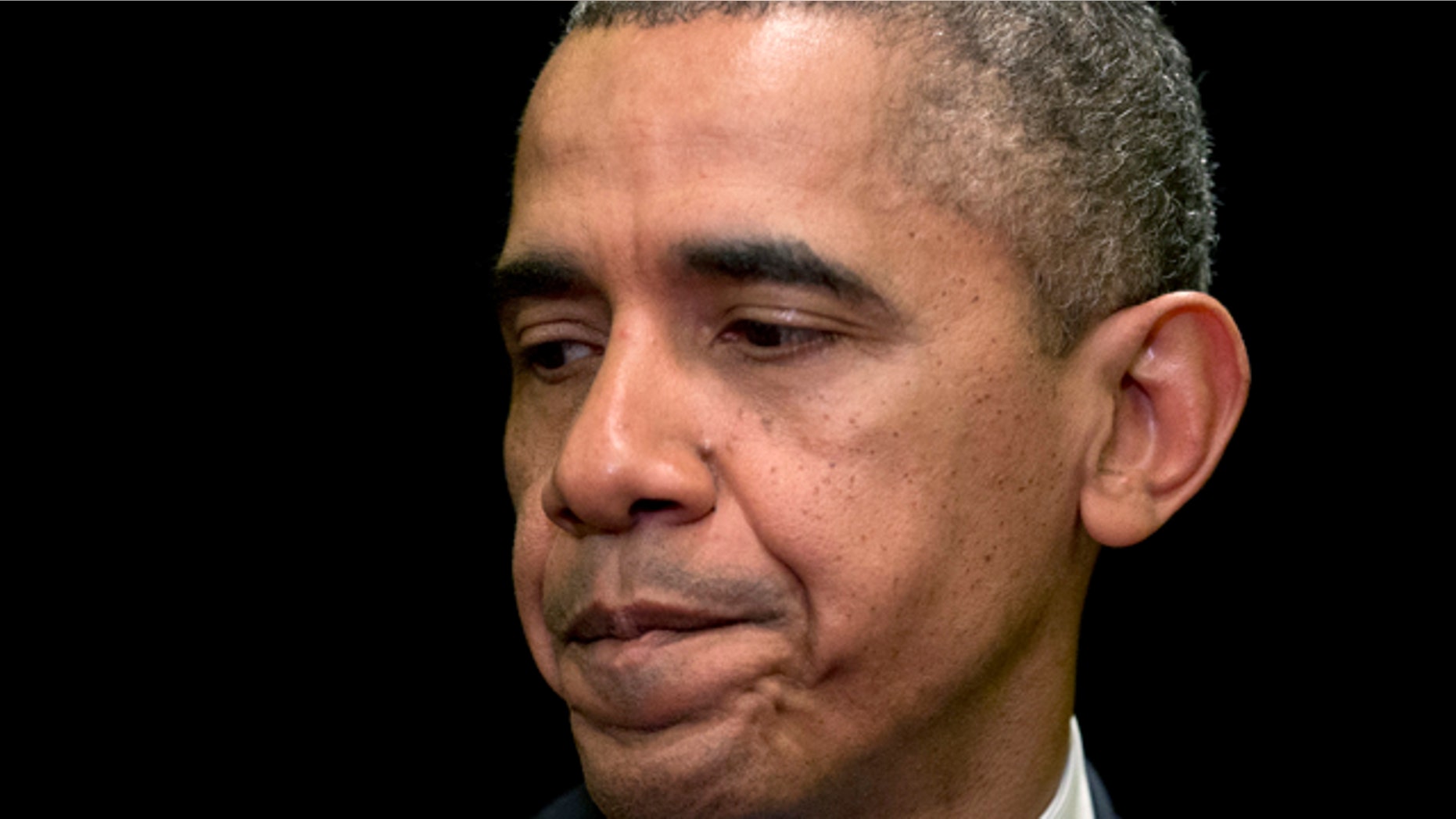 April 2, 2014: President Barack Obama pauses as he speaks about the shooting at Fort Hood in Chicago. (AP Photo/Carolyn Kaster)