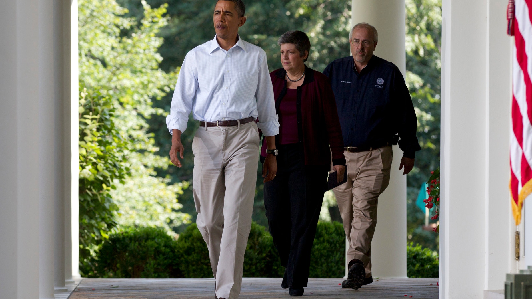President Obama walks with Craig Fugate and Janet Napolitano to the White House Rose Garden Aug 28
