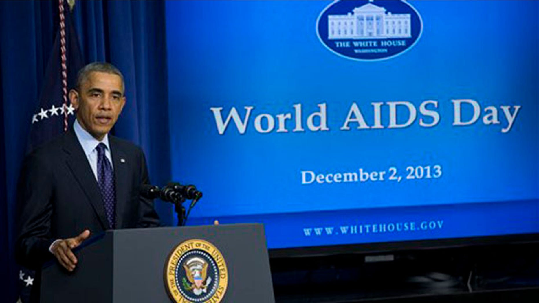 President Barack Obama gestures while speaking at a world AIDS Day event, Monday, Dec. 2, 2013, in the South Court Auditorium on the White House complex in Washington. (AP Photo/ Evan Vucci)