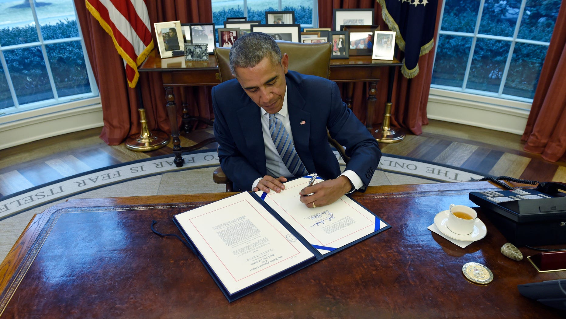 President Obama signs the Department of Homeland Security Appropriations Act on March 4, 2015.