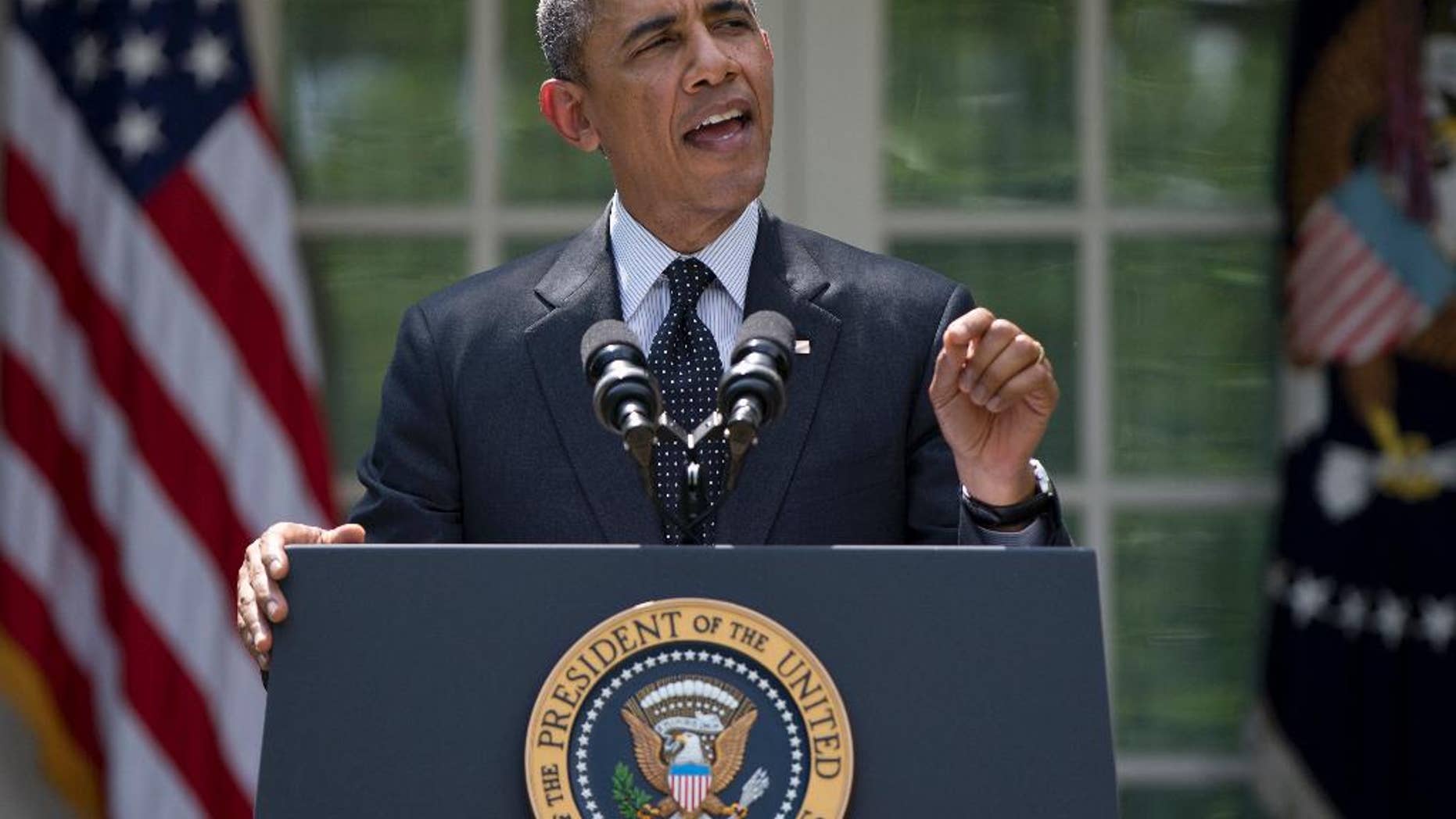 FILE - This May 27, 2014, file photo shows President Barack Obama, standing in the White House Rose Garden, and speaking about the future of US troops in Afghanistan. Obama outlined a timetable for the gradual withdrawal of the last U.S. troops in Afghanistan, and confidently declared, "This is how wars end in the 21st century." But less than three weeks later, there is a sudden burst of uncertainty surrounding the way Obama has moved to bring the two conflicts he inherited to a close. In Iraq, a fast-moving Islamic insurgency is pressing toward Baghdad, raising the possibility of fresh American military action more than two years after the last U.S. troops withdrew. (AP Photo/Carolyn Kaster)