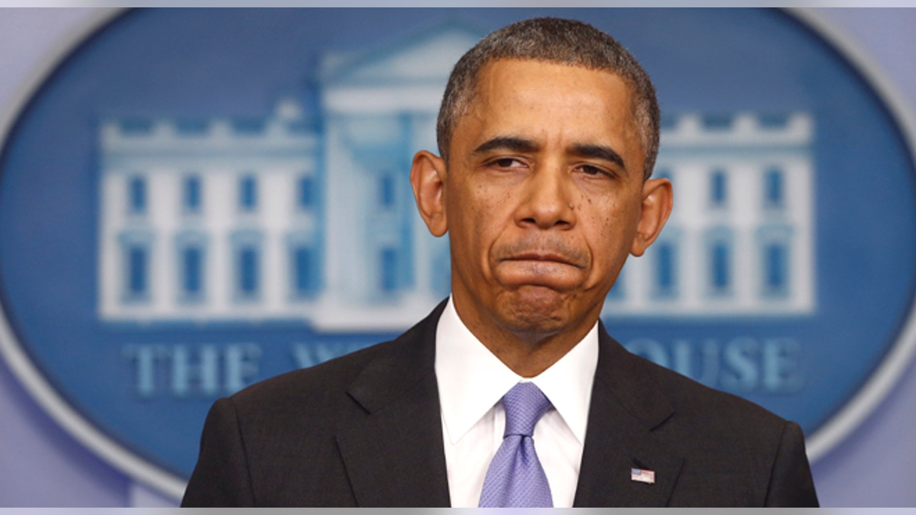 President Barack Obama pauses while speaking about his signature health care law, Thursday, Nov. 14, 2013, in the Brady Press Briefing Room of the White House in Washington. Bowing to pressure, President Barack Obama intends to permit continued sale of individual insurance plans that have been canceled because they failed to meet coverage standards under the health care law, officials said Thursday. (AP Photo/Charles Dharapak)
