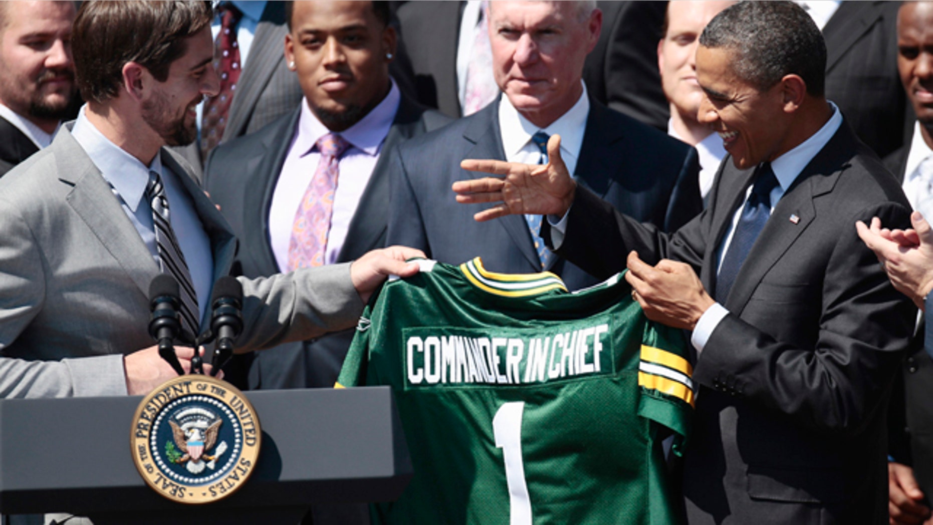 Aug. 12, 2011: President Obama is presented a Green Bay Packers football jersey by quarterback Aaron Rodgers, left, during a ceremony honoring the Super Bowl XLV Champion Green Bay Packers.