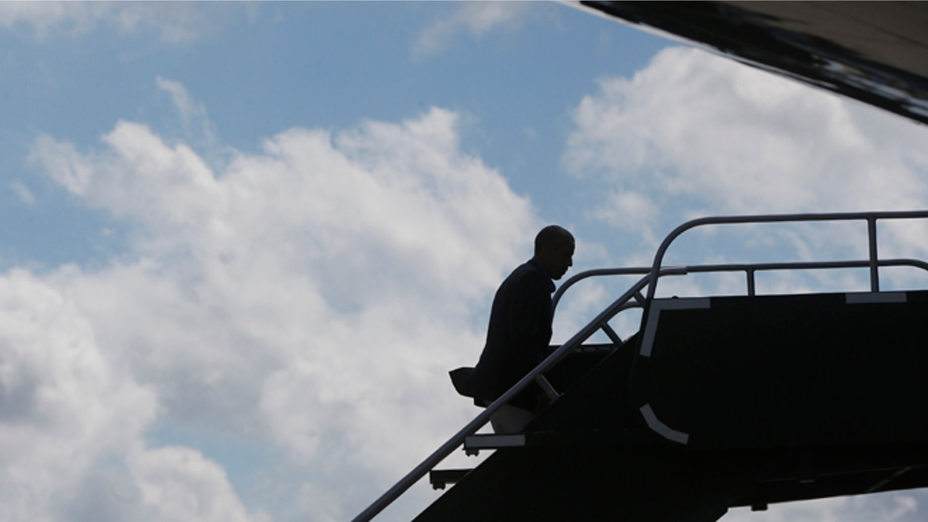 President Barack Obama boards Air Force One in Milwaukee, Monday, Sept. 1, 2014.