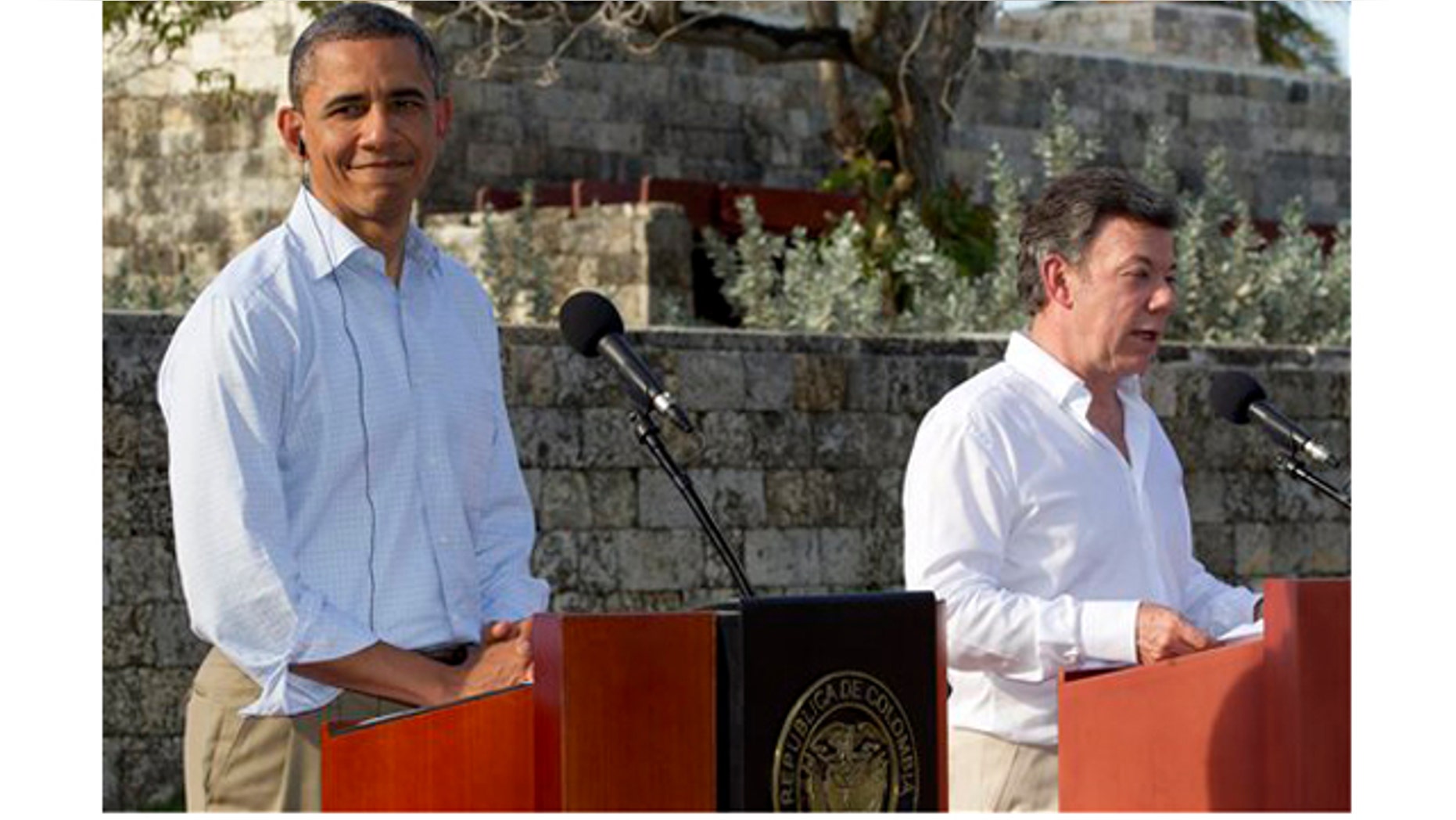 President Barack Obama, left, and Colombian President Juan Manuel Santos attend a joint news conference during the 6th Summit of the Americas in Cartagena, Colombia, Sunday, April 15, 2012. (AP Photo/Carolyn Kaster)