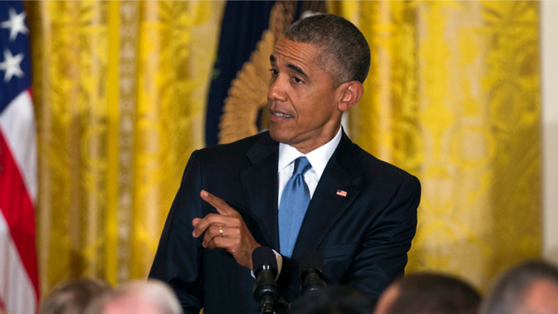 President Barack Obama responds to a heckler as he speaks during a reception to celebrate LGBT Pride Month in the East Room of the White House, on Wednesday, June 24, 2015, in Washington. (AP Photo/Evan Vucci)