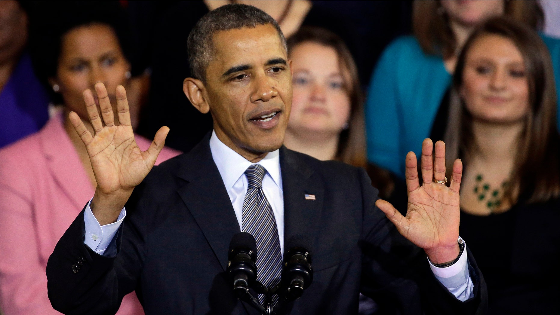 FILE - In this Oct. 30, 2013, file photo, President Barack Obama speaks at Boston's historic Faneuil Hall about the federal health care law. Obama says he's sorry Americans are losing health insurance plans he repeatedly said they could keep under his signature health care law. But the president stopped short of apologizing for making those promises in the first place. "I am sorry that they are finding themselves in this situation based on assurances they got from me," he said in an interview Thursday, Nov. 7 with NBC News. (AP Photo/Stephan Savoia, File)