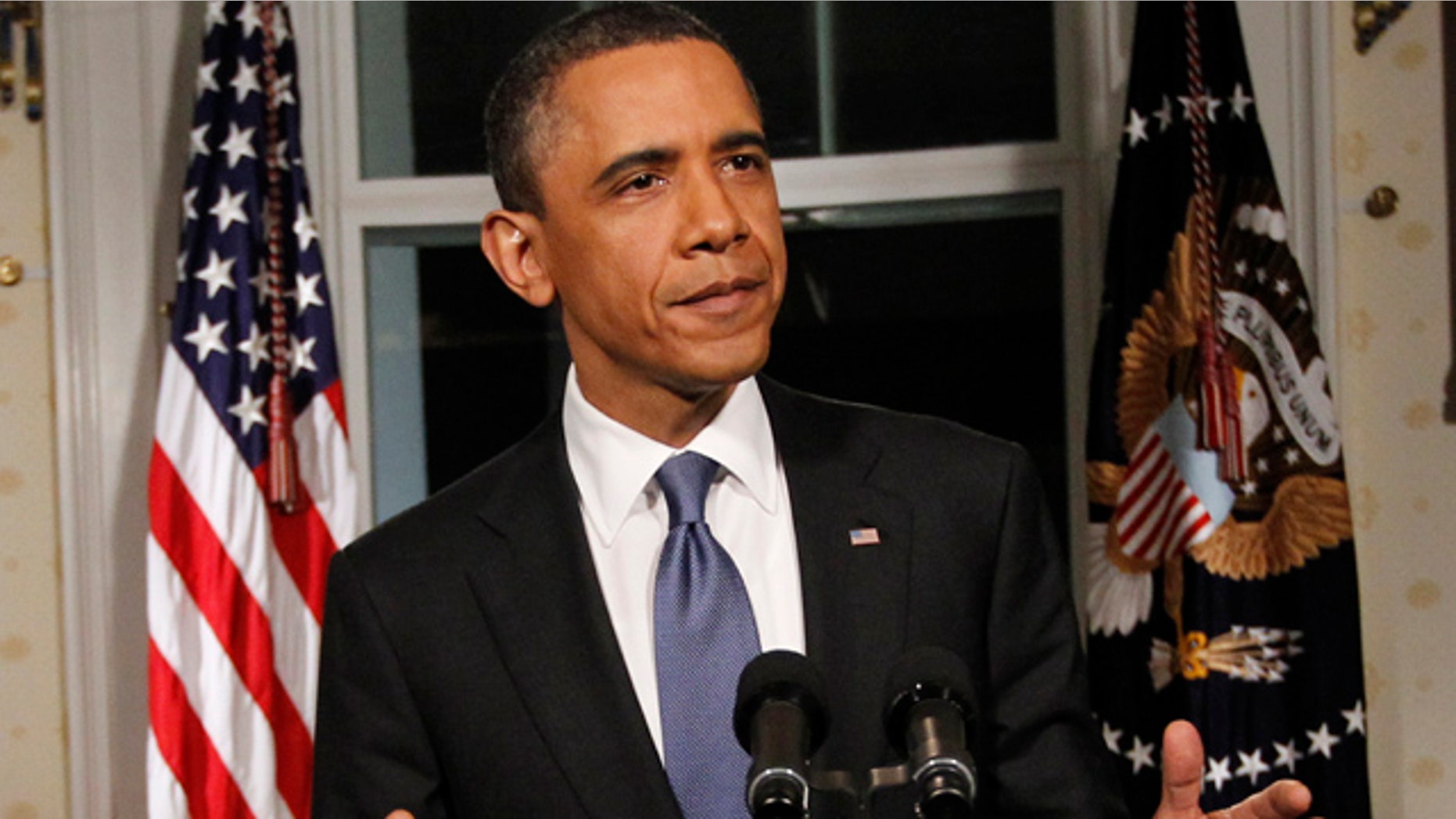 April 8, 2011: President Obama poses for photographers in the Blue Room at the White House in Washington after he spoke regarding the budget and averted government shutdown after a deal was made between Republican and Democrat lawmakers.