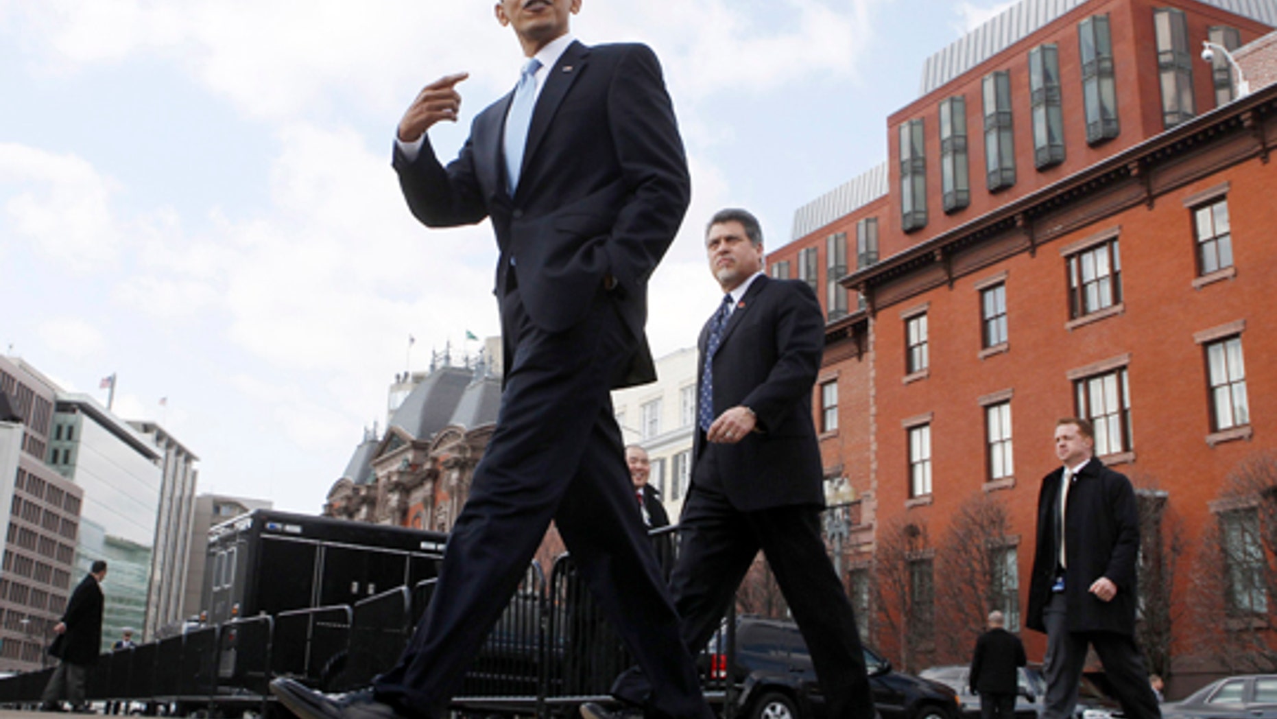 Feb. 25, 2010: President Obama walks away from the Blair House during a lunchbreak at a health care summit with bipartisan leaders from Capitol Hill in Washington.