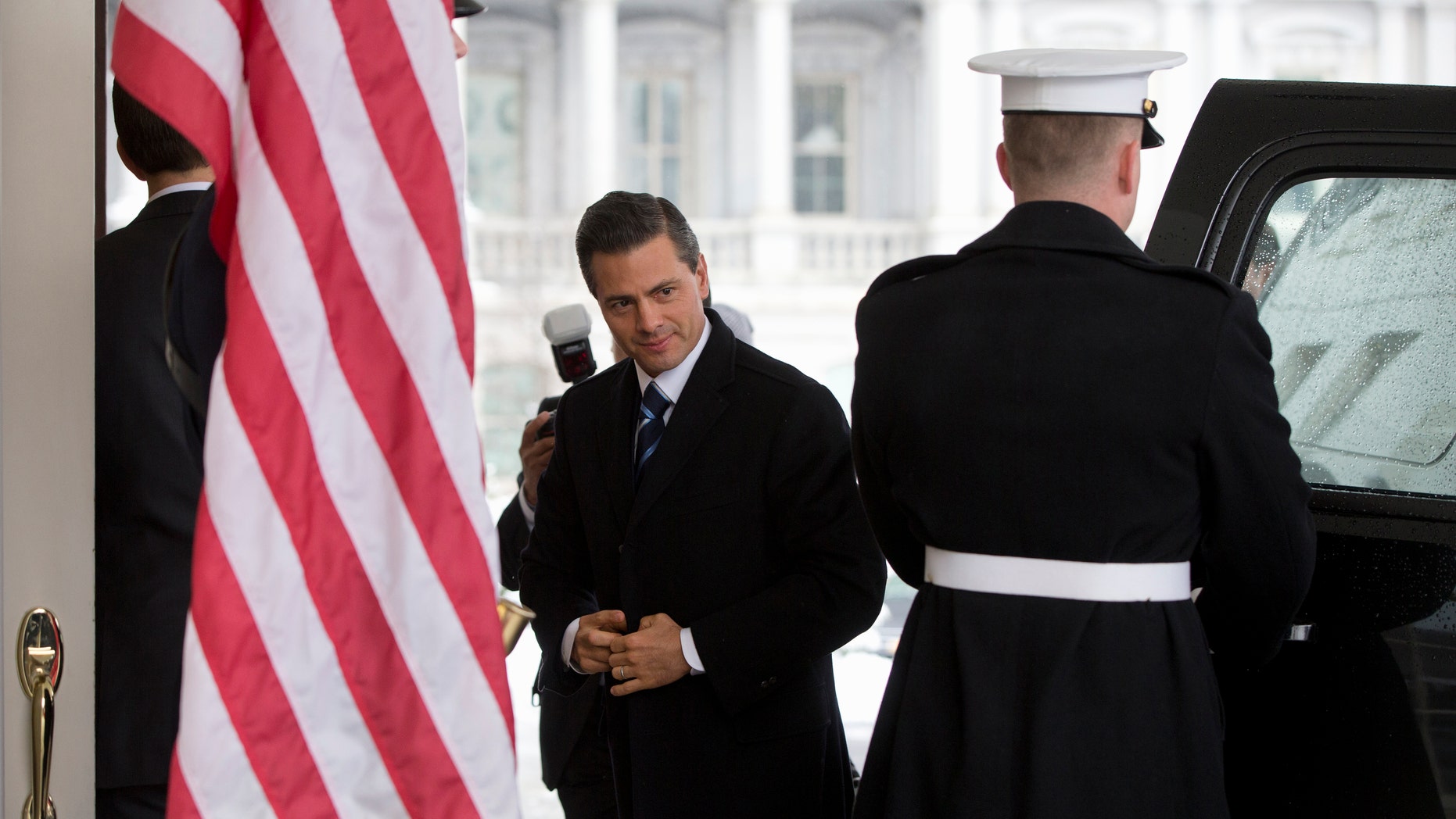 Mexico's President Enrique Pena Nieto at the White House in Washington, Tuesday, Jan. 6, 2015, for meetings with President Barack Obama. Obama is looking to his southern neighbor for help implementing the changing policies on immigration and Cuba. (AP Photo/Carolyn Kaster)