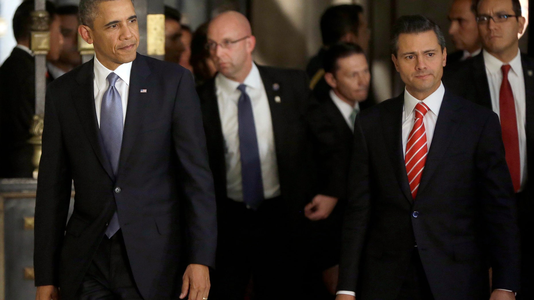 May 2, 2013: President Barack Obama, left, and Mexicos President Enrique Pena Nieto, right, arrive for a news conference at the Palacio Nacional in Mexico City.