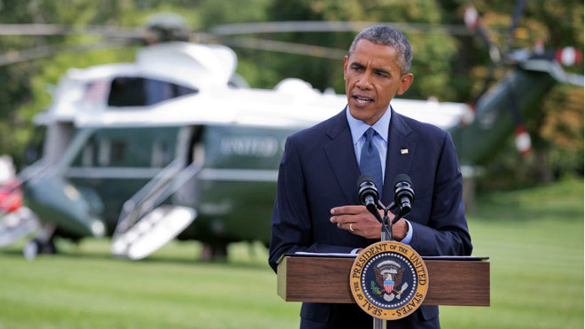 President Barack Obama speaks on the South Lawn of the White House in Washington, Tuesday, July 29, 2014.