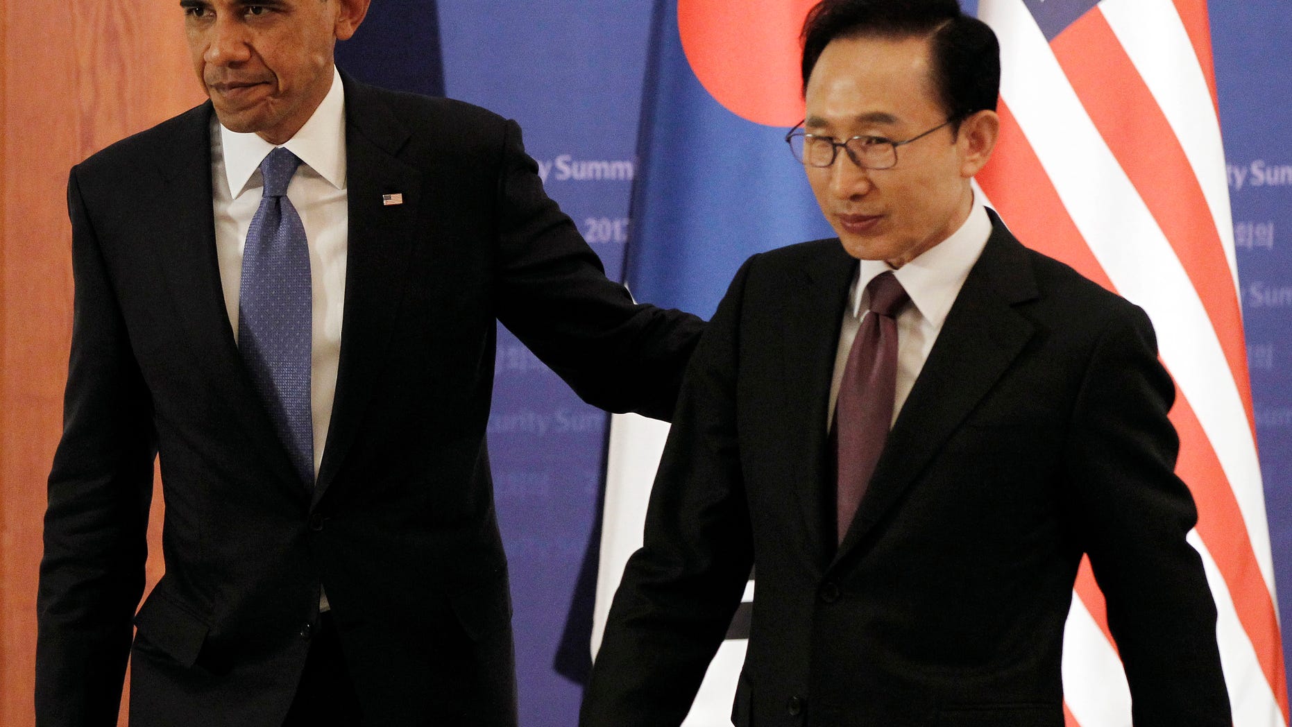 March 25: U.S. President Barack Obama and South Korean President Lee Myung-bak, right, walk out together after their joint news conference at the presidential Blue House in Seoul, South Korea.