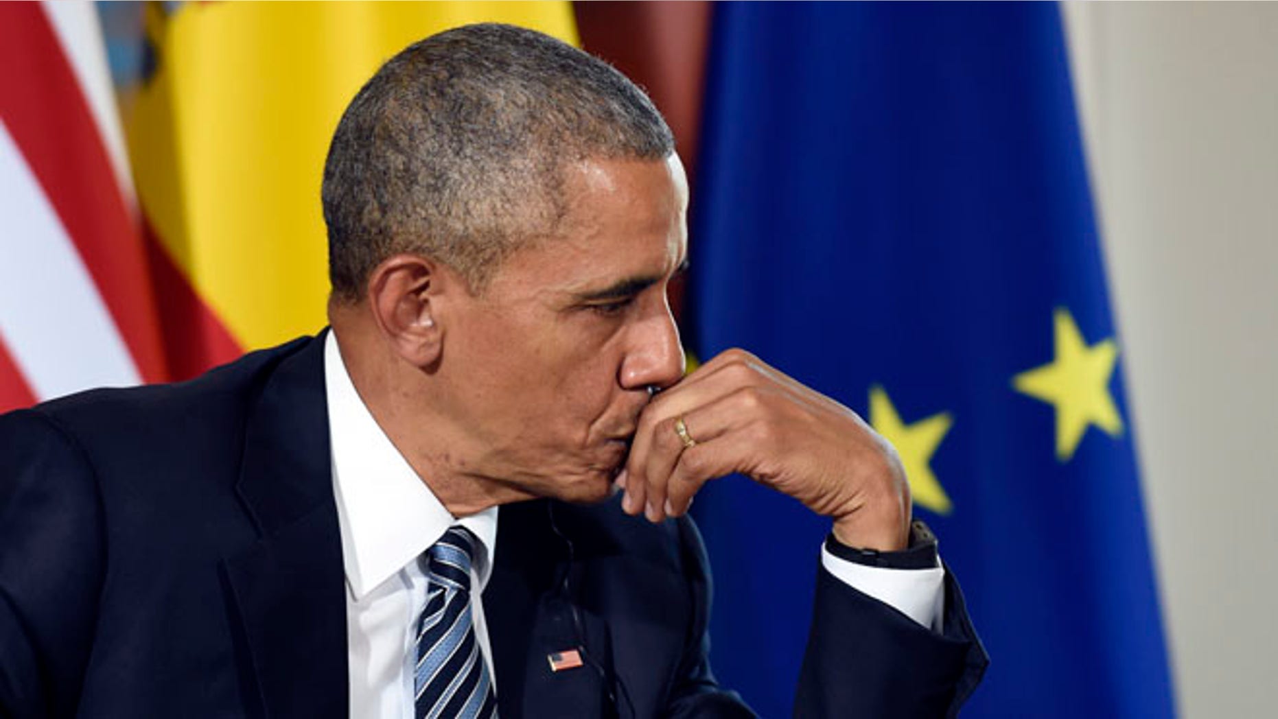 U.S President Barack Obama listens as Spain's acting Prime Minister Mariano Rajoy speaks during a media availability in Madrid, Spain, at the Palacio de la Moncloa, Sunday, July 10, 2016. (AP Photo/Susan Walsh)