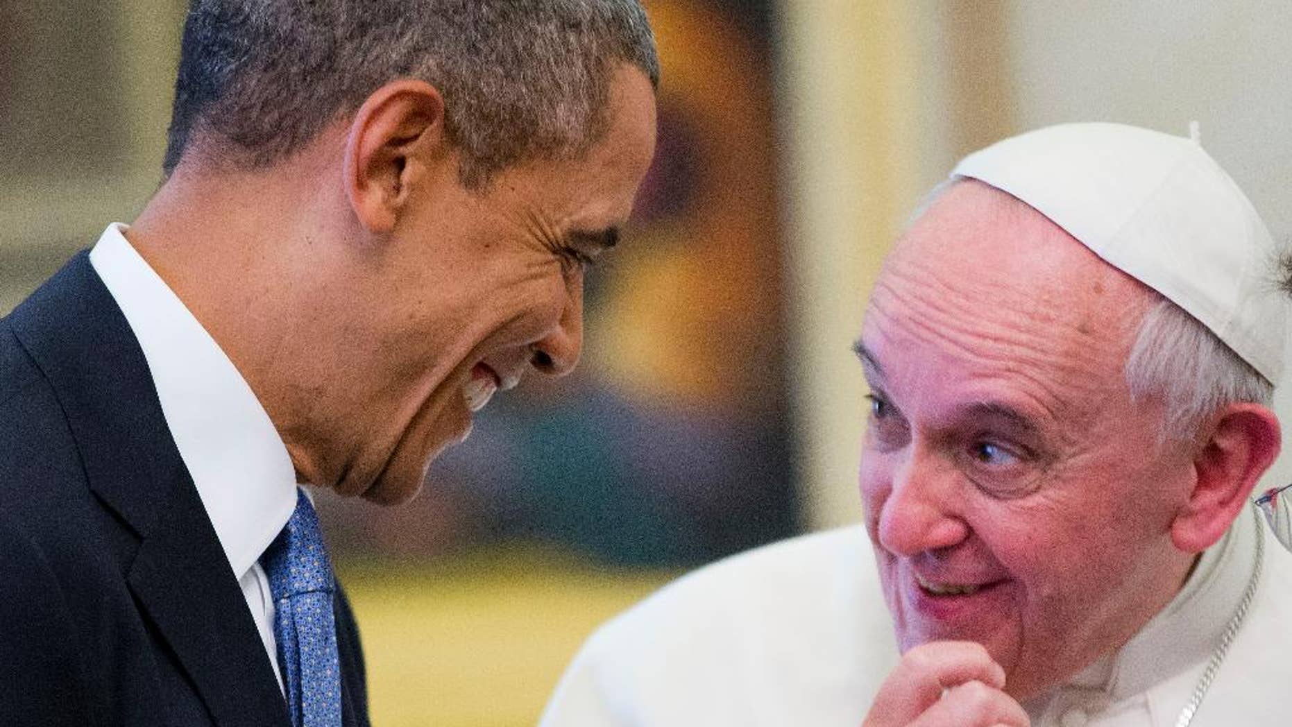 US President Barack Obama meets with Pope Francis, Thursday, March 27, 2014 at the Vatican. Obama called himself a "great admirer" of Pope Francis as he sat down at the Vatican Thursday with the pontiff he considers a kindred spirit on issues of economic inequality. Their historic first meeting comes as Obama's administration and the church remain deeply split on issues of abortion and contraception. On the right is Msgr. Mark Miles, who was the english translator for the Pontiff. (AP Photo/Pablo Martinez Monsivais)