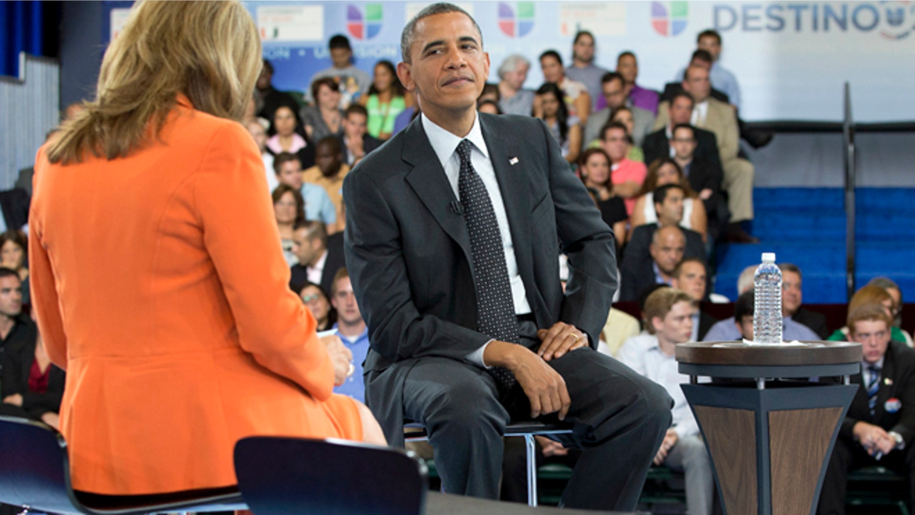 President Barack Obama participates in a town hall hosted by Univision and Univision news anchor Maria Elena Salinas, left, at the University of Miami, Thursday, Sept. 20, 2012, in Coral Gables, Fla. (AP Photo/Carolyn Kaster)