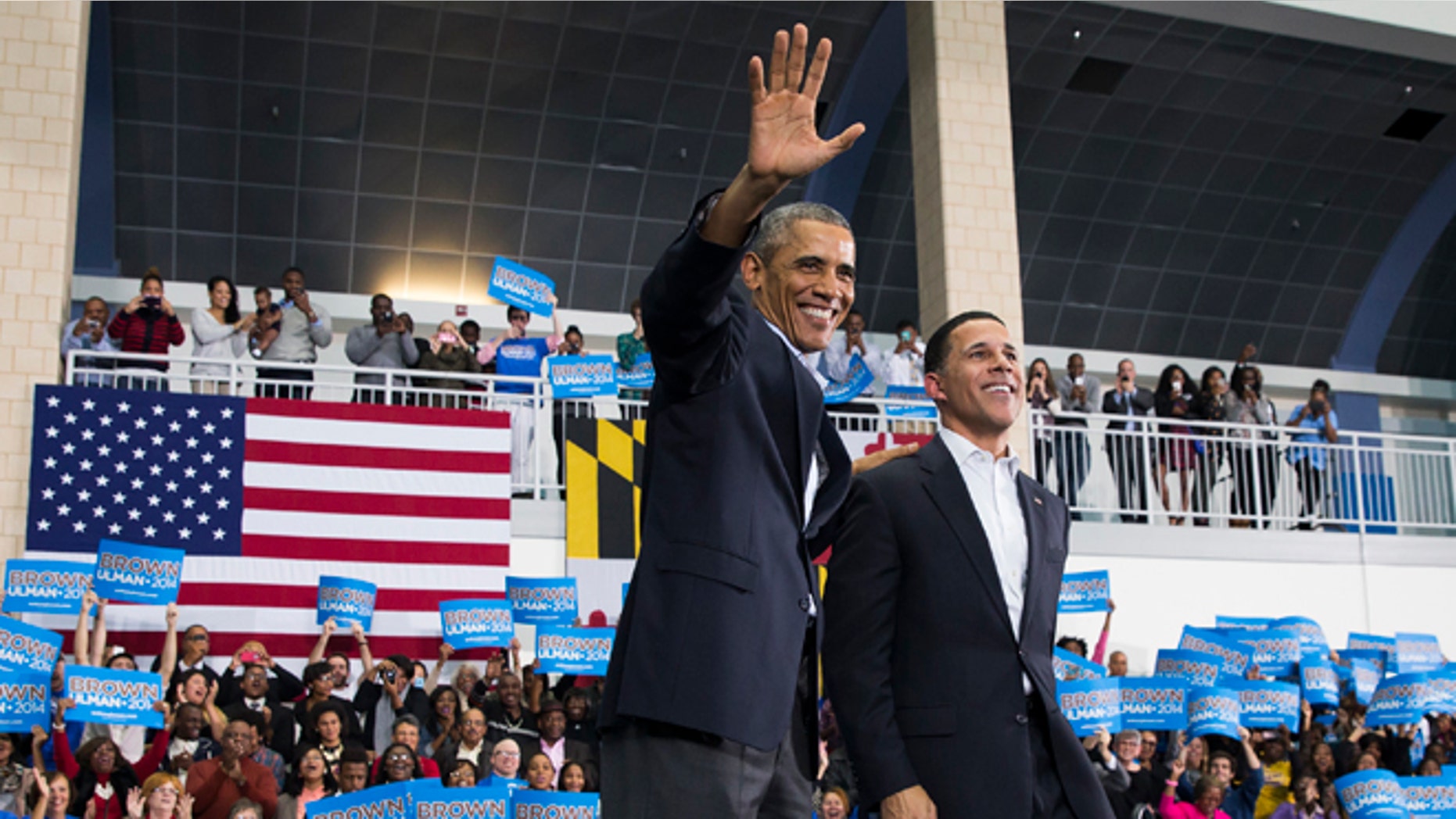 In this Sunday, Oct. 19, 2014 photo, President Barack Obama, left, stands with Maryland gubernatorial candidate Anthony Brown during a campaign rally at Wise High School in Upper Marlboro, Md.