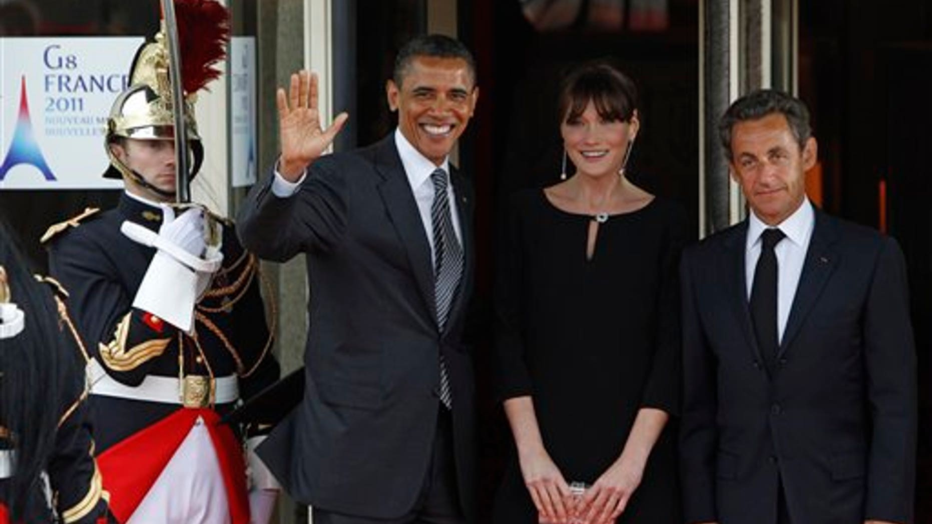May 26: French President Nicolas Sarkozy and his wife Carla Bruni-Sarkozy welcome President Barack Obama during a dinner meeting for the G8 summit in Deauville, France.