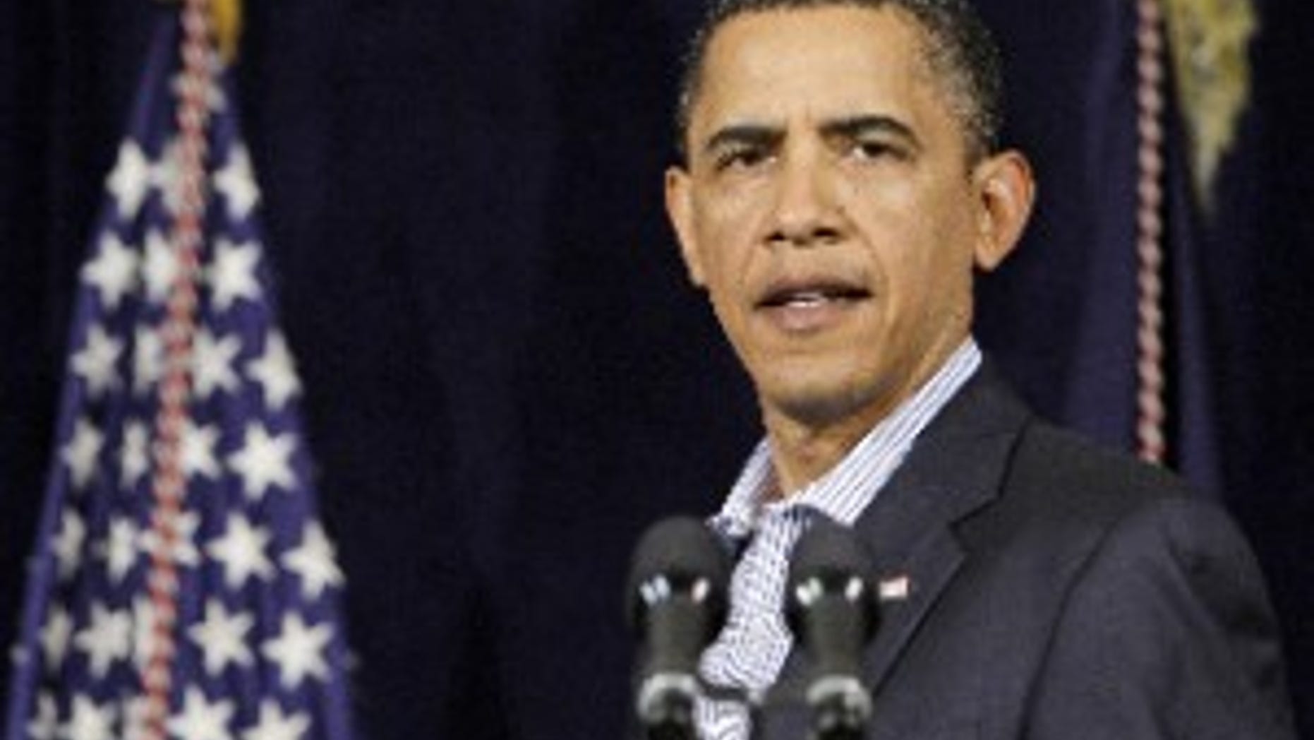 President Barack Obama speaks at the Marine Corps Base Hawaii in Kaneohe Bay, Hawaii Tuesday, Dec. 29, 2009. (AP Photo/Alex Brandon)