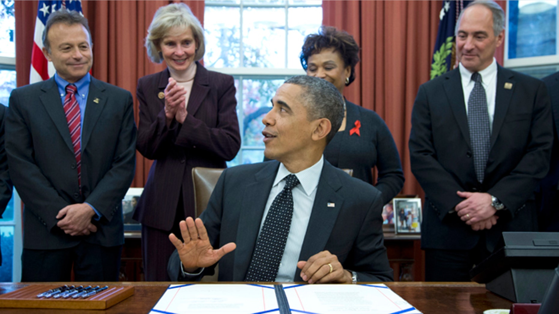 Nov. 21, 2013: President Barack Obama speaks in the Oval Office of the White House in Washington, after signing S. 330: the HIV Organ Policy Equity Act.