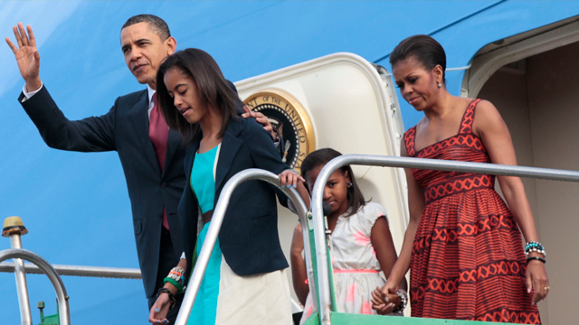 March 19: President Obama and the First Family emerge from Air Force One after arriving in Brasilia, Brazil.
