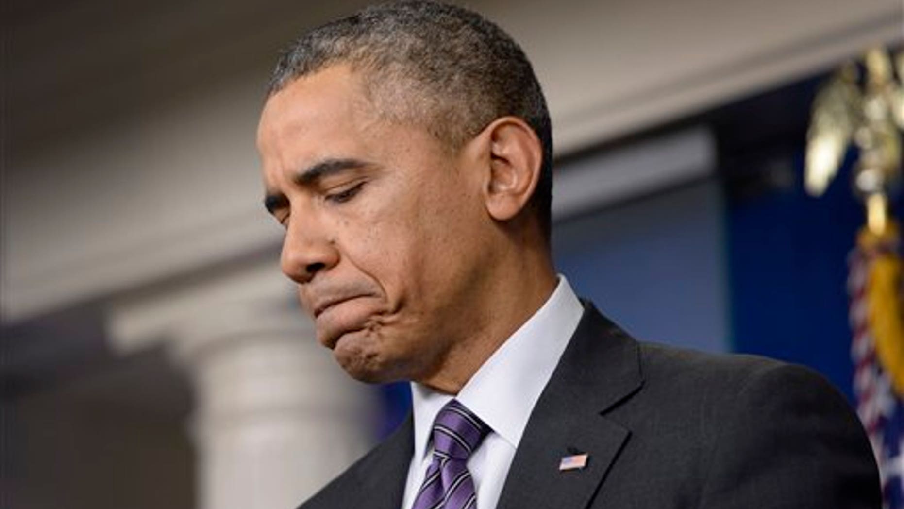 President Barack Obama pauses as he talks about the ferry disaster in South Korea at the start of a news conference in the Brady Press Briefing Room of the White House in Washington, Thursday, April 17, 2014. Obama was asked about the Affordable Care Act, the crisis in Ukraine and other issues. (AP Photo/Susan Walsh)
