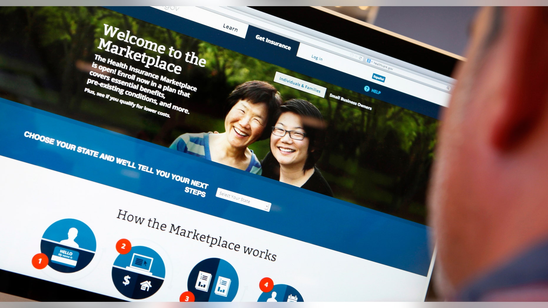 A man looks over the Affordable Care Act (commonly known as Obamacare) signup page on the HealthCare.gov website in New York.