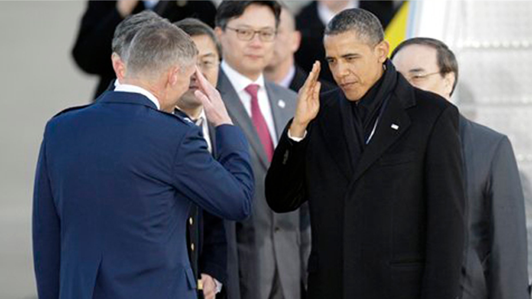 Mar. 25, 2012: President Barack Obama salutes upon arrival at Osan Air Base to attend the Nuclear Security Summit, in Osan, south of Seoul, South Korea.