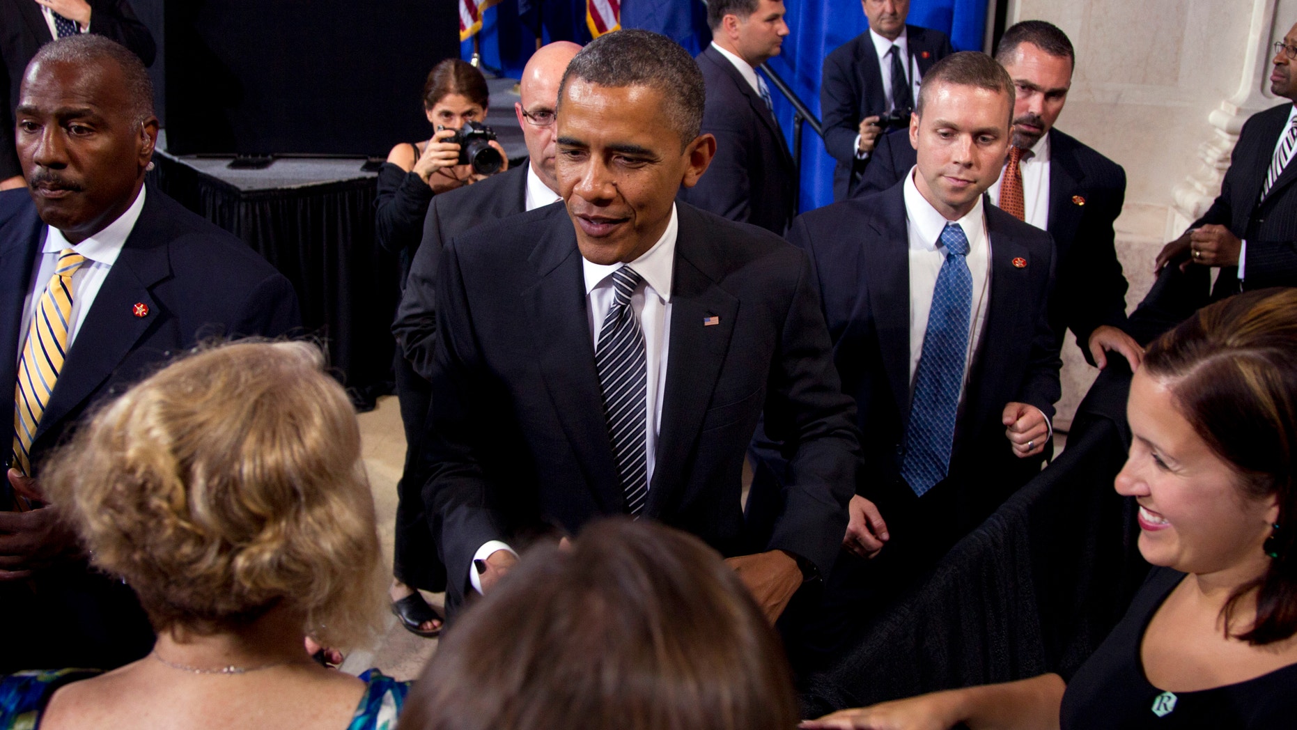 June 12, 2012: President Barack Obama greets people in the audience after speaking at a campaign event at The Franklin Institute.