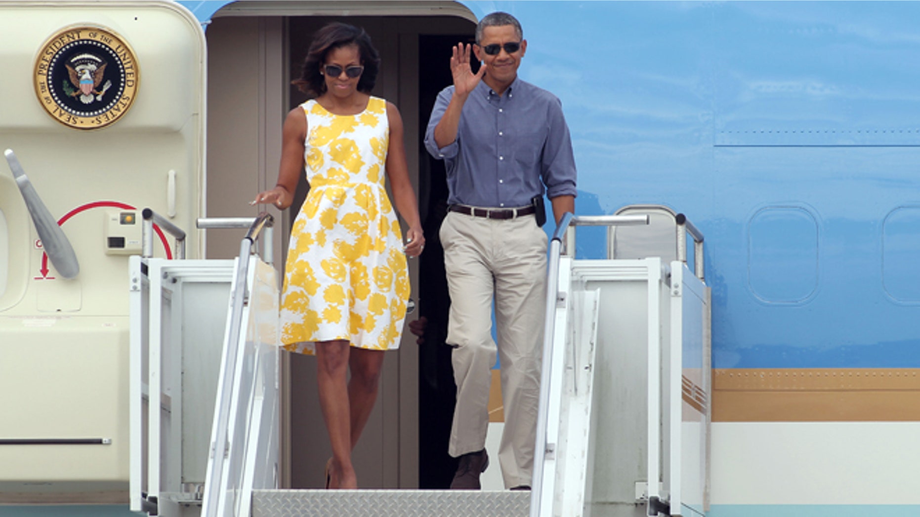 Aug 10, 2013: President Barack Obama and first lady Michelle Obama arrive at the Cape Cod Coast Guard Station in Bourne, Mass.,en route to a family vacation on Martha's Vineyard.