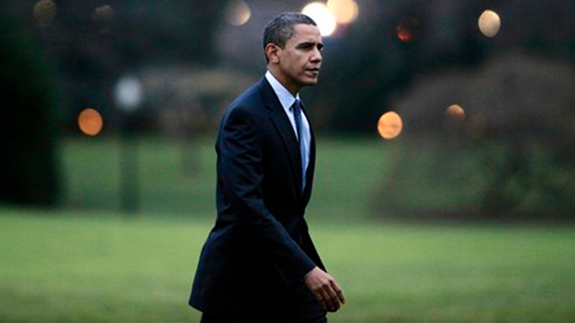 President Obama walks on the South Lawn of the White House in Washington, Friday, Dec. 4, 2009, after he returned from a trip to Allentown, Pa. (AP)
