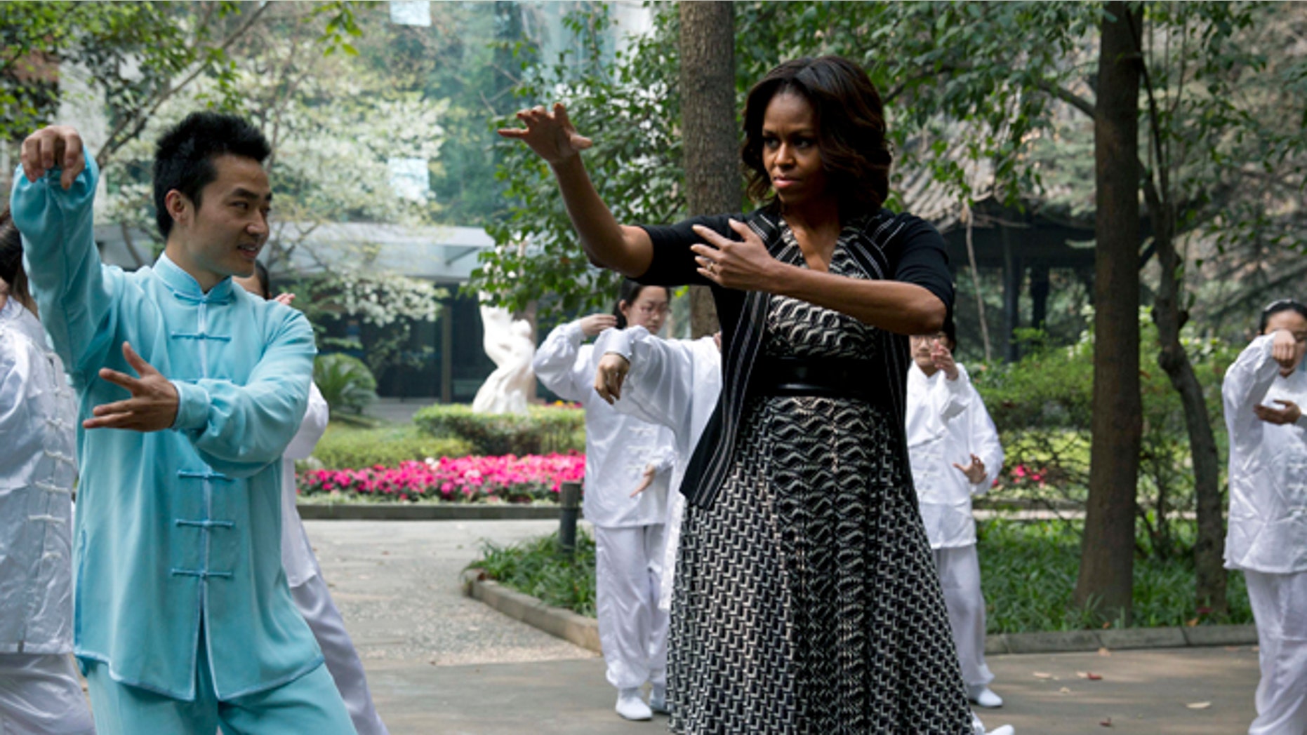 March 25, 2014: First lady Michelle Obama practices tai chi at a high school in Chengdu in southwest China's Sichuan province.