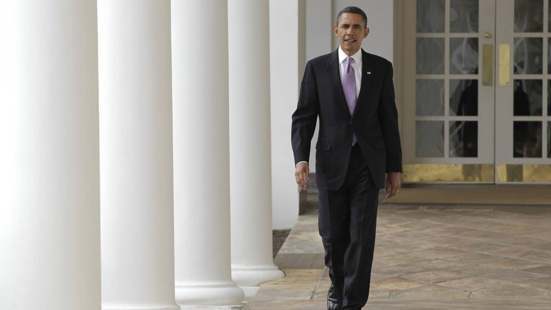 On the day of his State of the Union address, President Barack Obama strides from the Oval Office along the Colonnade at the White House in Washington, Tuesday, Jan. 25, 2011. (AP Photo/J. Scott Applewhite)
