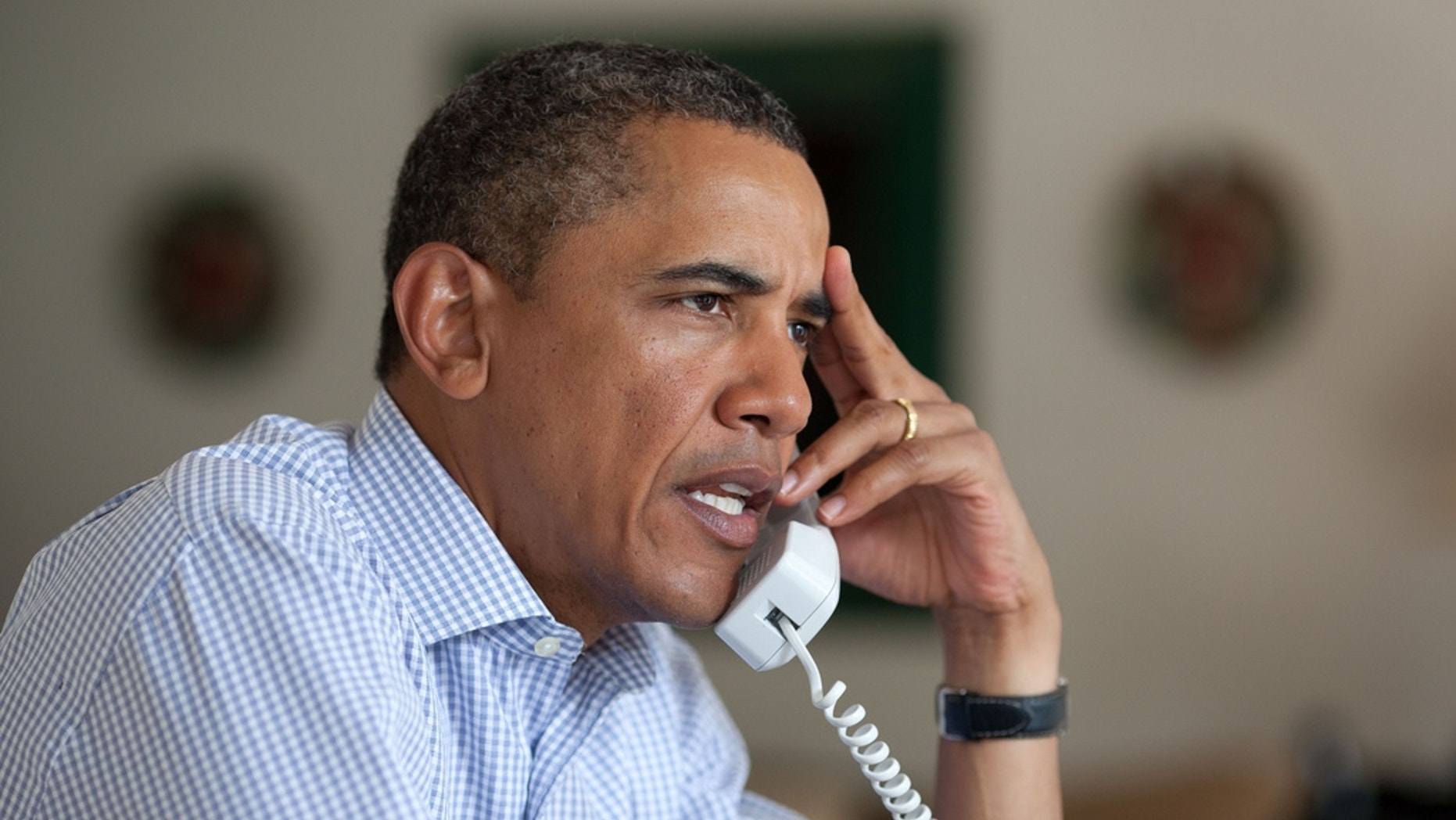 President Barack Obama holds conference call on Hurricane Irene with FEMA Director Craig Fugate, Homeland Security Secretary Janet Napolitano, Chief of Staff Bill Daley, and John Brennan, Assistant to the President for Homeland Security on Friday morning. (Official White House Photo)