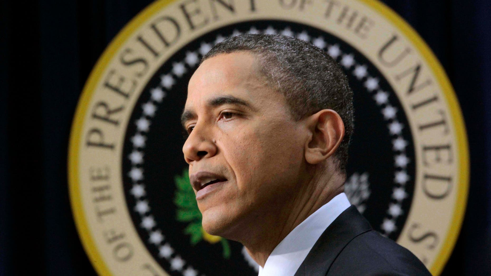 March 11: Obama makes an opening statement during a press conference on the White House complex in Washington. On Saturday night, he joined select members of the press for an elite dinner in Washington, D.C.