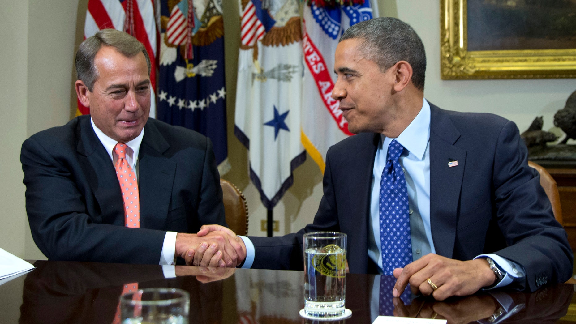 President Barack Obama shakes hands with House Speaker John Boehner of Ohio in the Roosevelt Room of the White House in Washington, Friday, Nov. 16, 2012, during a meeting to discuss the deficit and economy. (AP Photo/Carolyn Kaster)