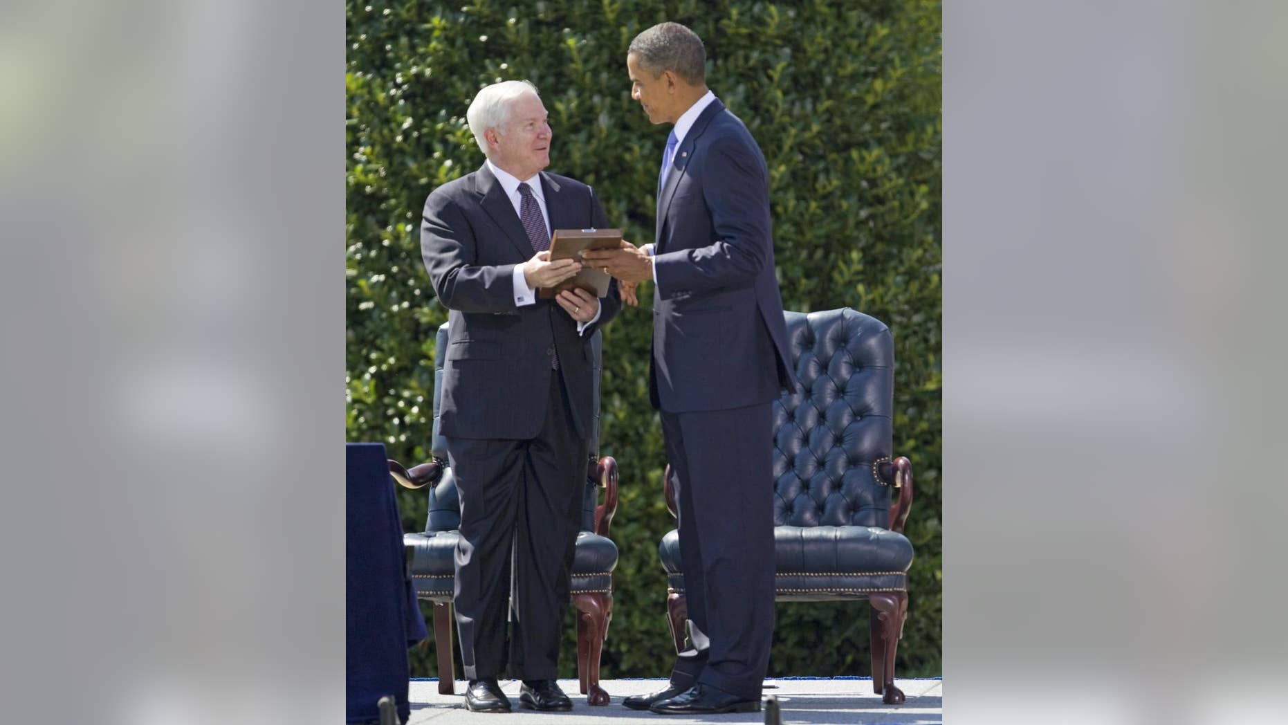 President Barack Obama presents outgoing Defense Secretary Robert Gates with the Presidential Medal of Freedom during a farewell ceremony for Gates, Thursday, June 30, 2011, at the Pentagon. (AP Photo/Evan Vucci)
