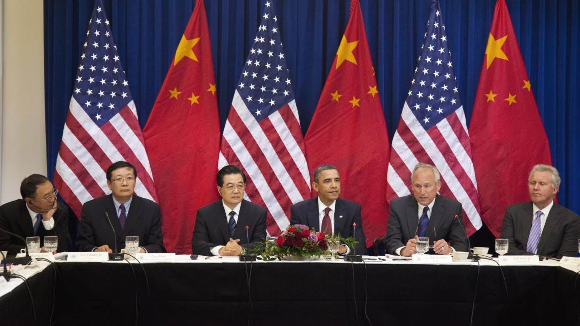President Barack Obama and China's President Hu Jintao, meet with business leaders, Wednesday, Jan. 19, 2011, in the Eisenhower Executive Office Building on the White House complex in Washington. From left are, Liu Chuanzhi of Lenovo; Lou Jiwei of China Investment Corporation; President Hu; President Obama; Jim McNerney of CEO Boeing; and Jeff Immelt of CEO General Electric. (AP Photo/Evan Vucci)