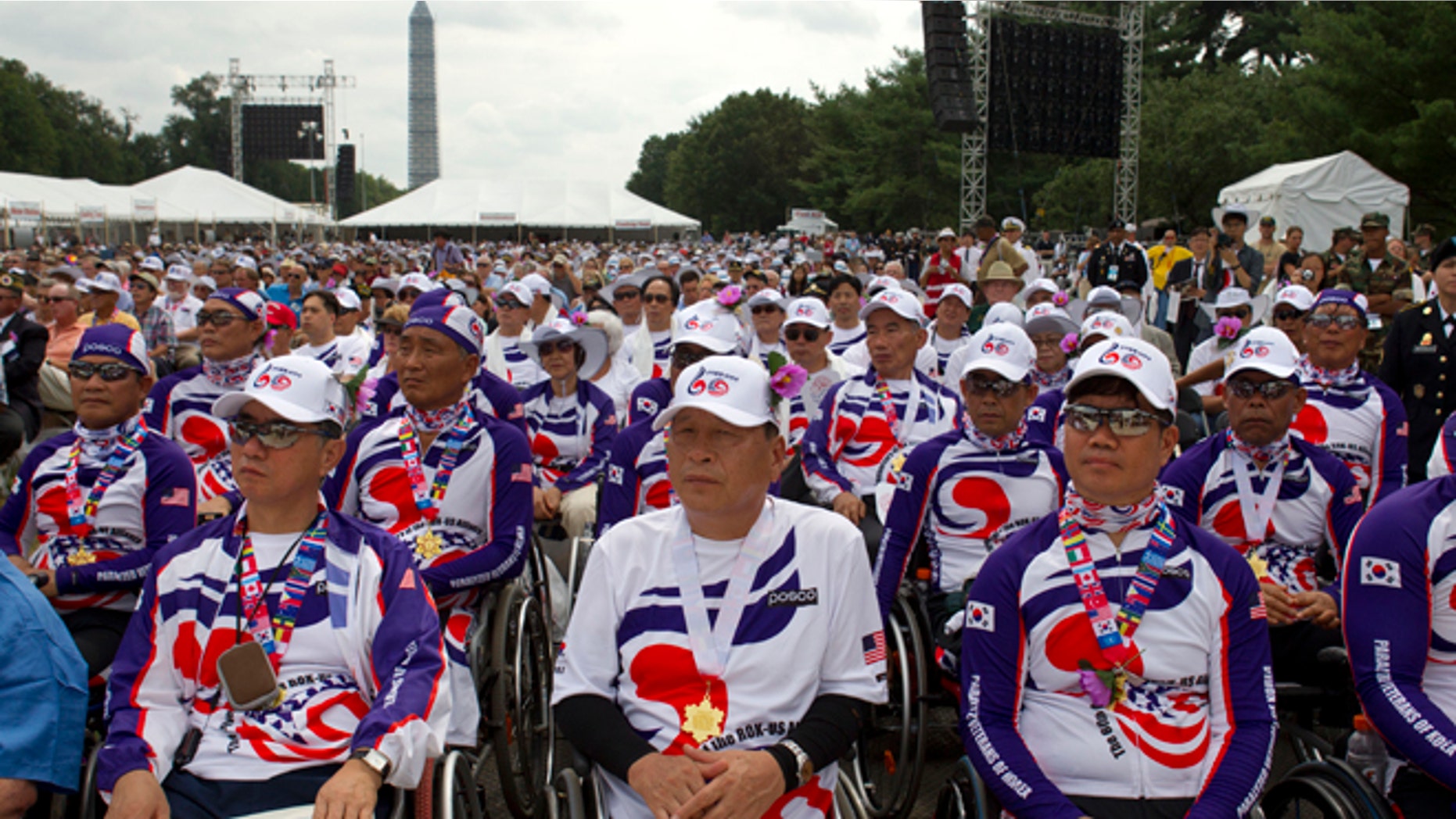 Saturday, July 27, 2013: Paralyzed Veterans of Korea watch as President Obama speaks at a ceremony marking the 60th anniversary of the end of the Korean War, near the Korean War Veterans Memorial in Washington, D.C.