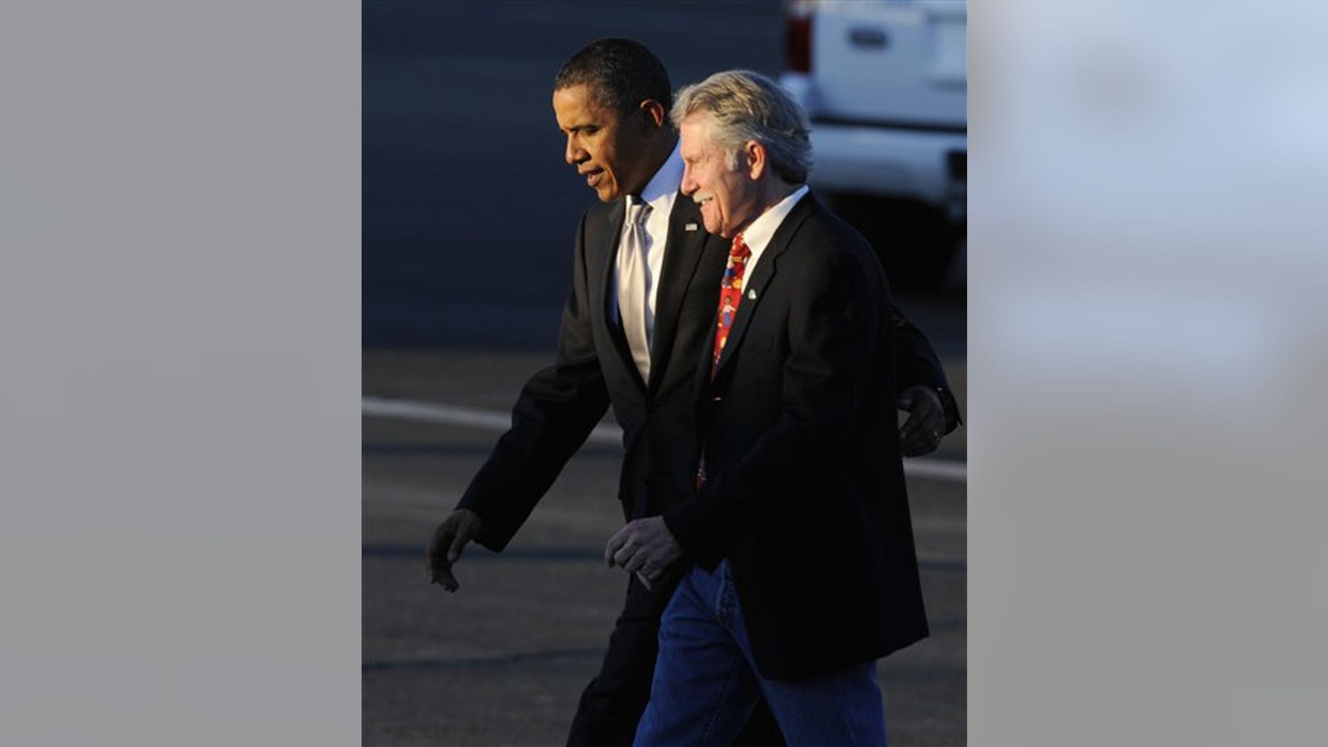 President Barack Obama walks with John Kitzhaber who is running for Oregon governor as he walks to greet supporters at Portland Air National Guard Base in Portland, Ore., Wednesday Oct 20, 2010. (AP Photo/Greg Wahl-Stephens)