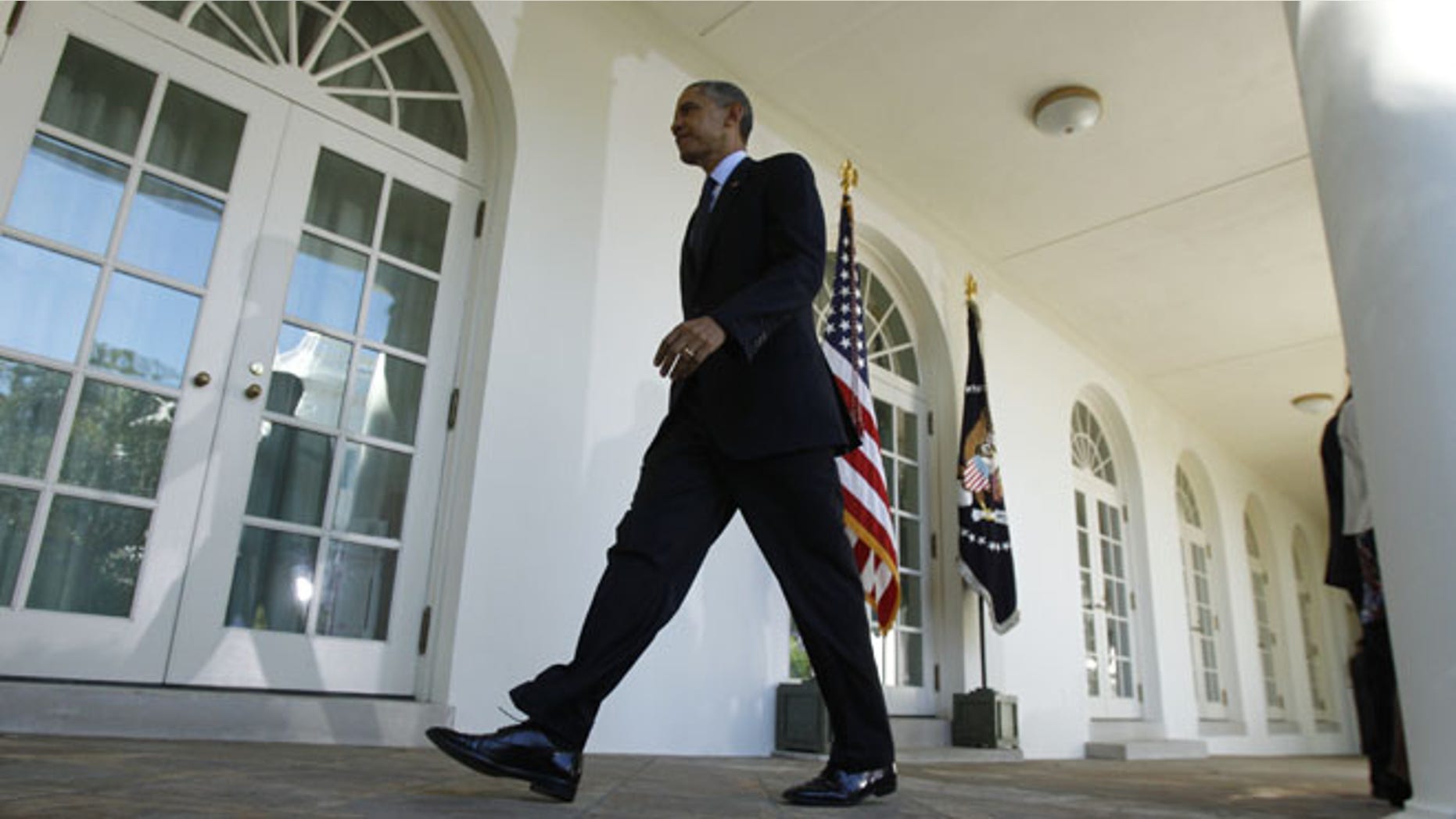U.S. President Barack Obama departs the Rose Garden of the White House in Washington October 21, 2013.