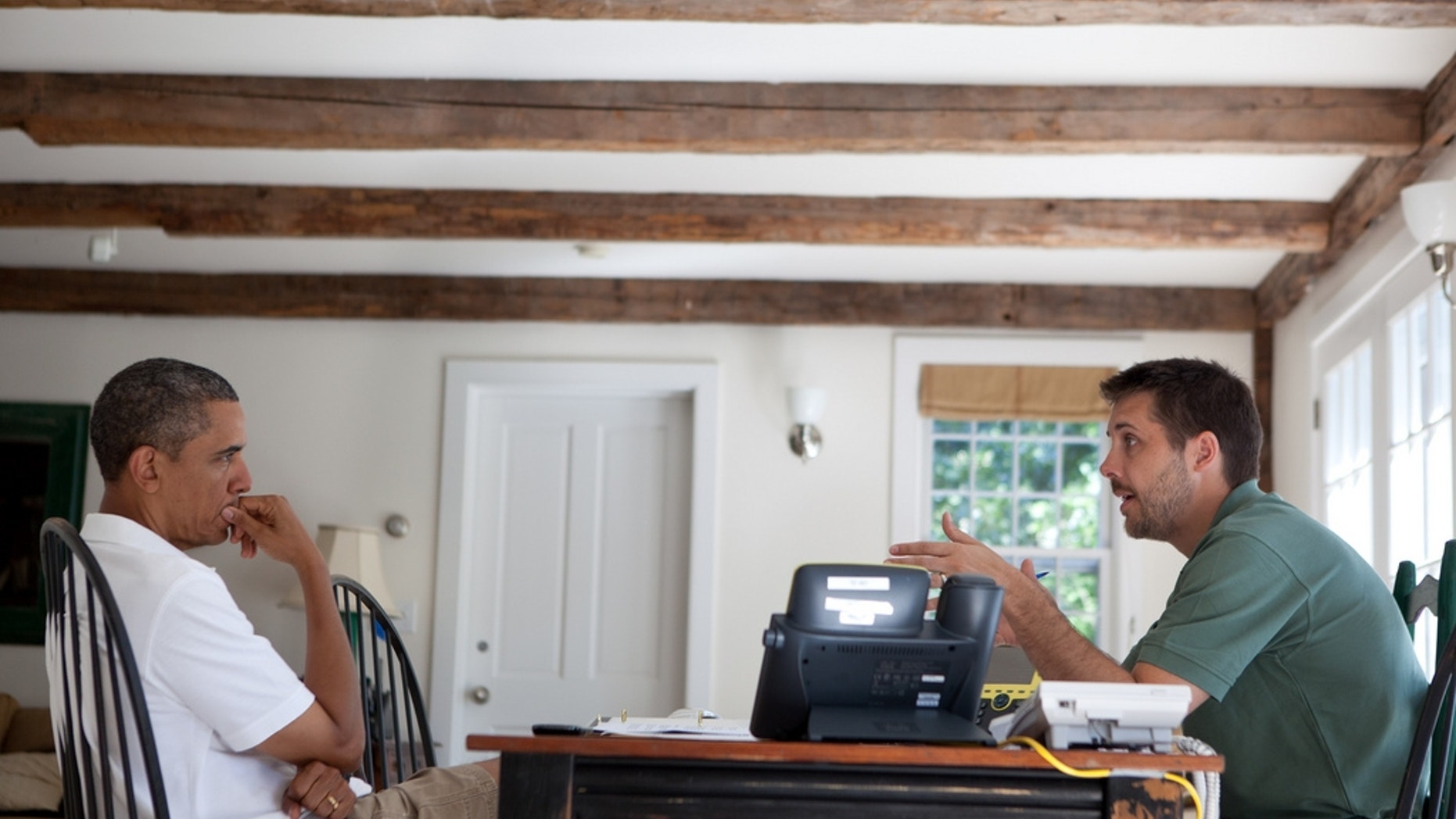President Obama is briefed by economic adviser Brian Deese on Martha's Vineyard. (Official White House Photo)