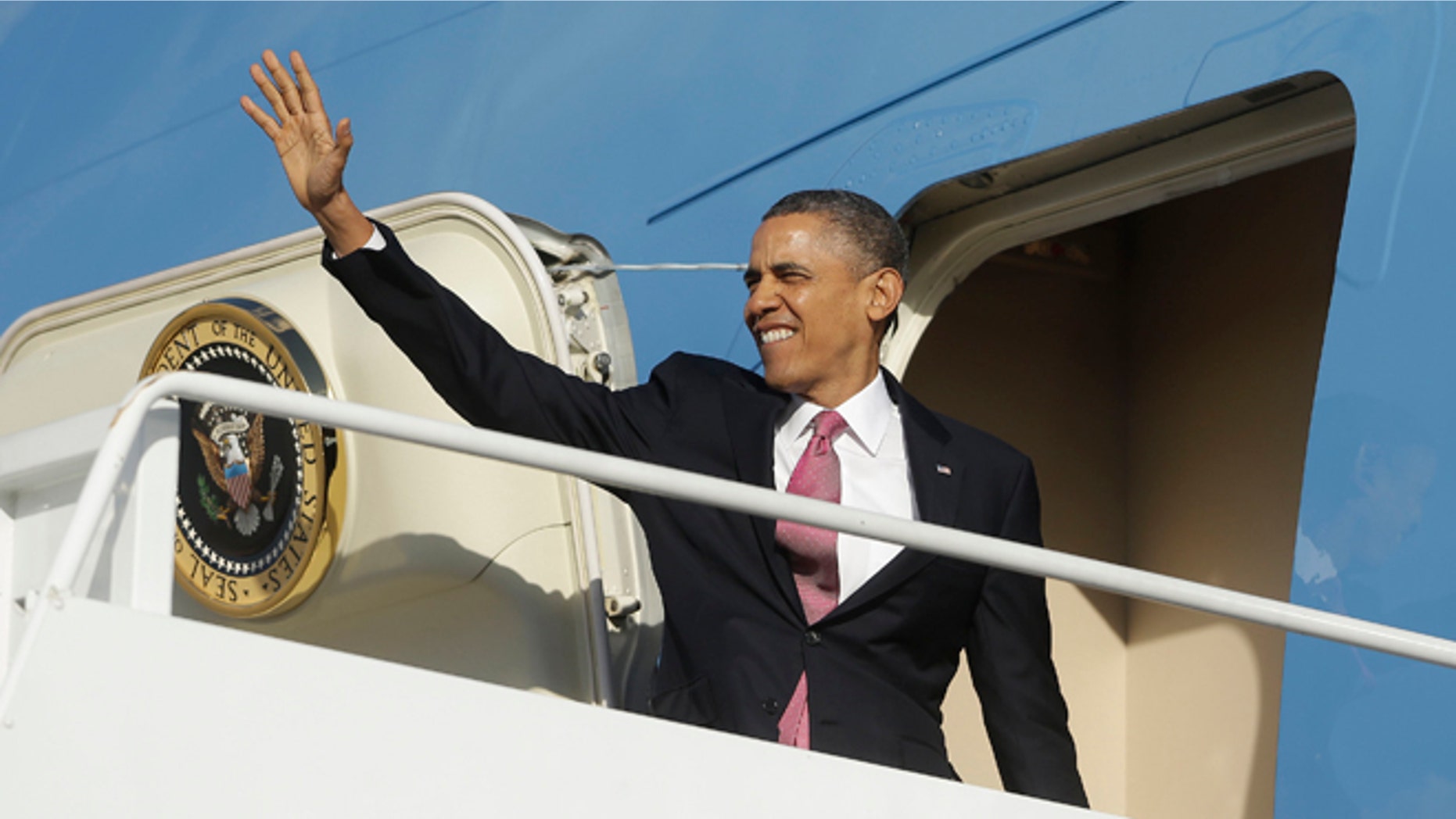 Sunday, Nov. 24, 2013: President Obama boards Air Force One from Andrews Air Force Base, in suburban Maryland.