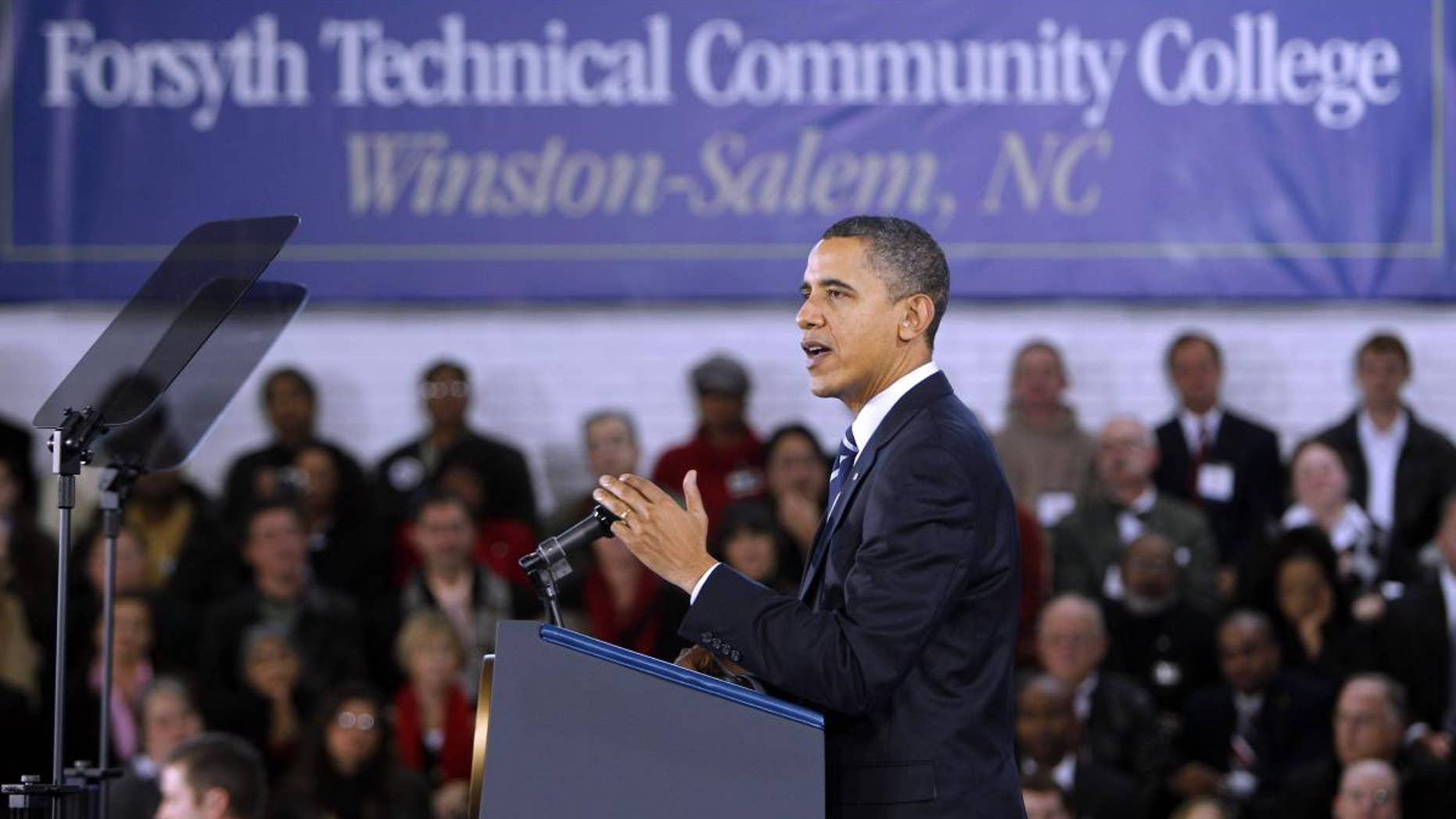 President Barack Obama gestures while speaking during a visit to Forsyth Technical Community College in Winston-Salem, N.C., Monday, Dec. 6, 2010. (AP Photo/Chuck Burton)