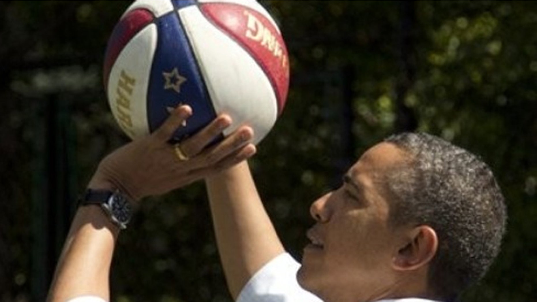 FILE: April 9, 2012: President Obama plays basketball during the annual White House Easter Egg Roll at the White House in Washington, D.C.