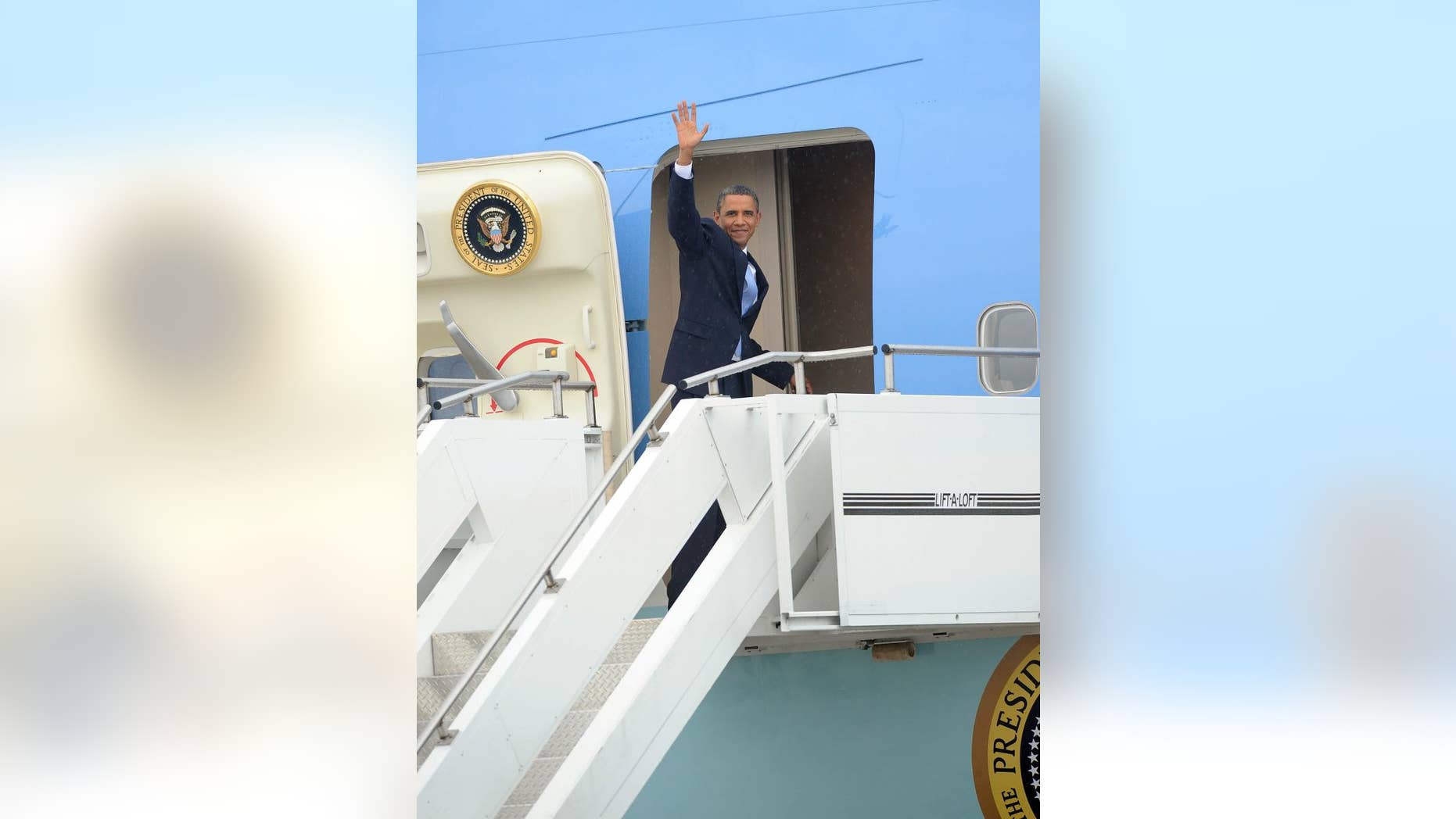 President Obama boards Air Force One/AP