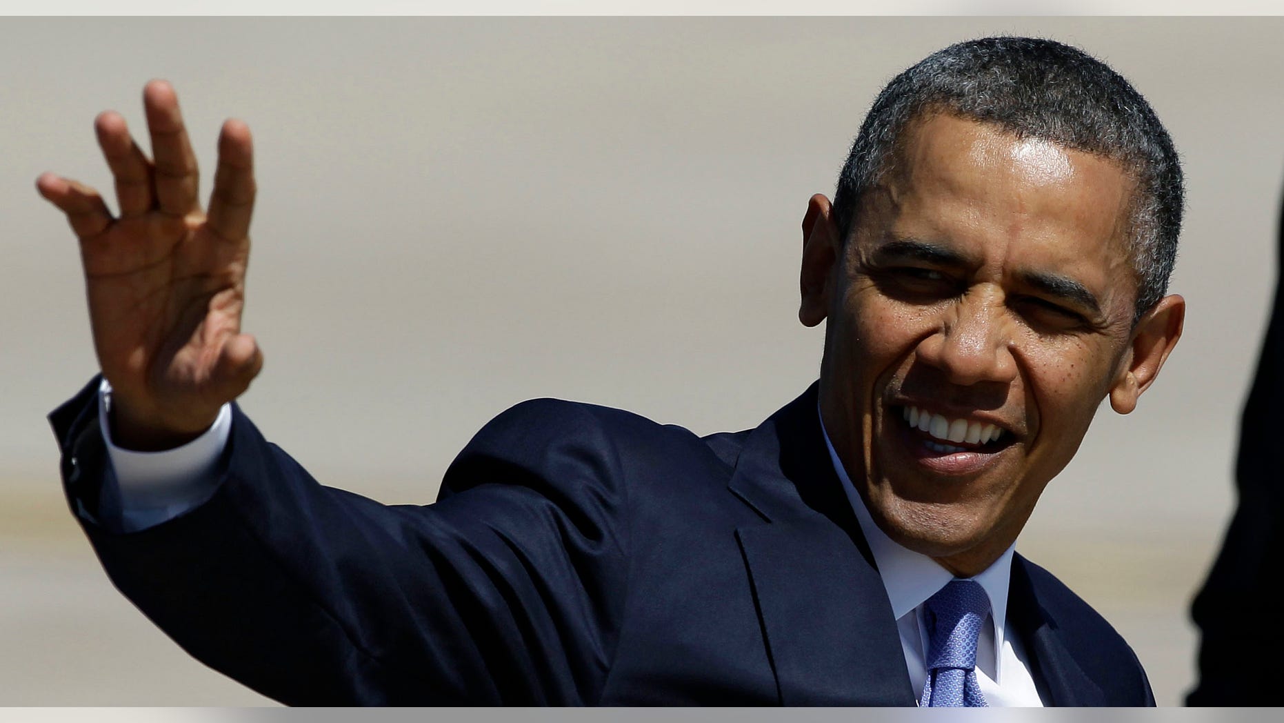 FILE: April 4, 2013: President Obama waves after his arrival at Buckley Air Force Base, Colo.