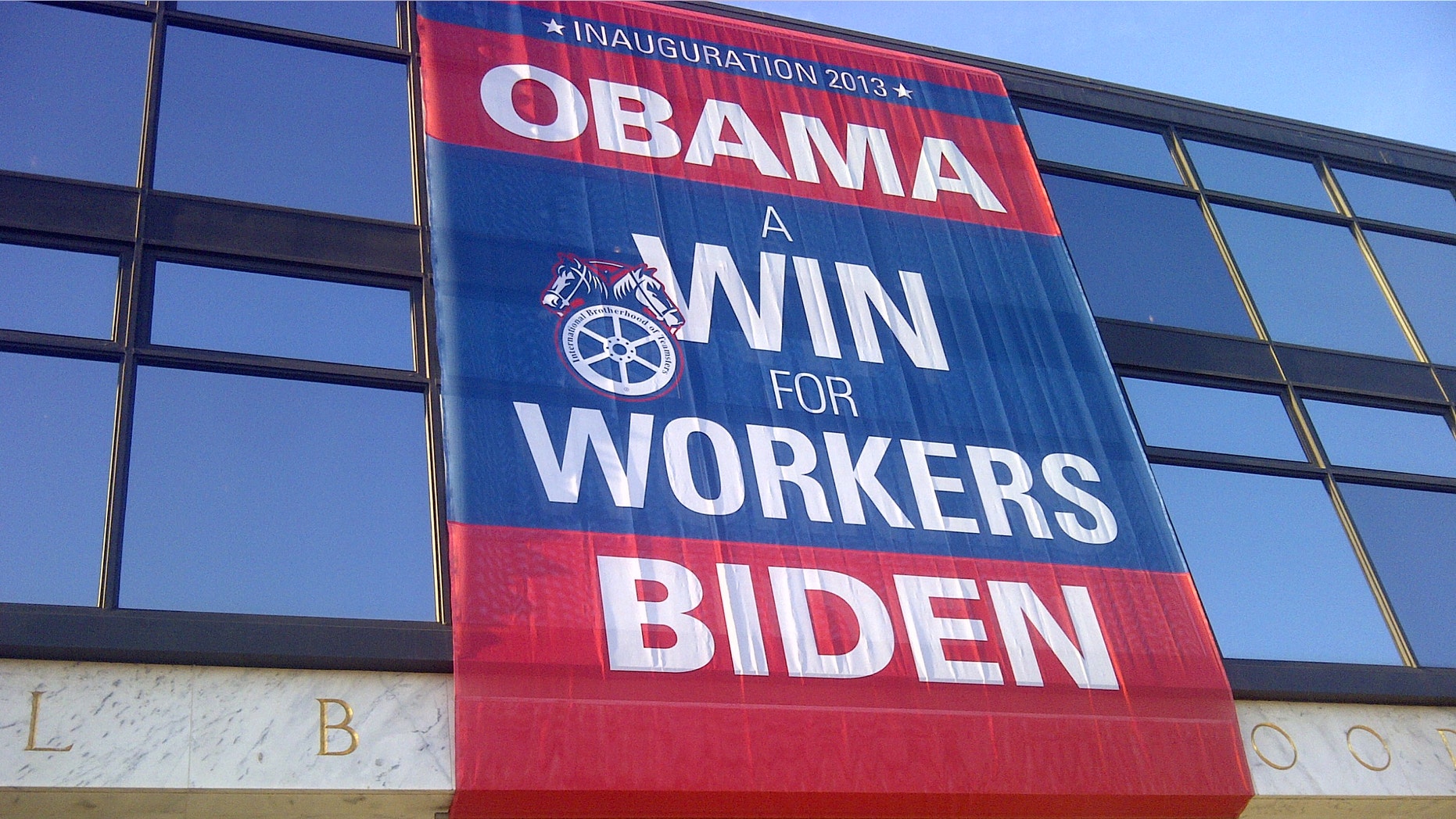 The Obama-Biden banner outside the AFL-CIO building on Capitol Hill is among the few noticeable signs in early January of the president's second inauguration, Jan. 21 in Washington, D.C.